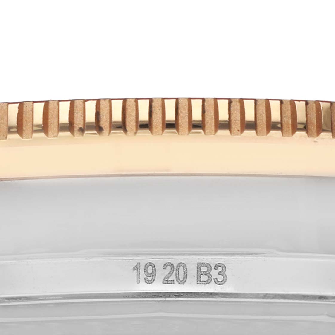 The image shows a close-up of the bezel edge and serial engraving on the Breitling Superocean U10370121B1A1 Men's Stainless Steel Black Dial watch.