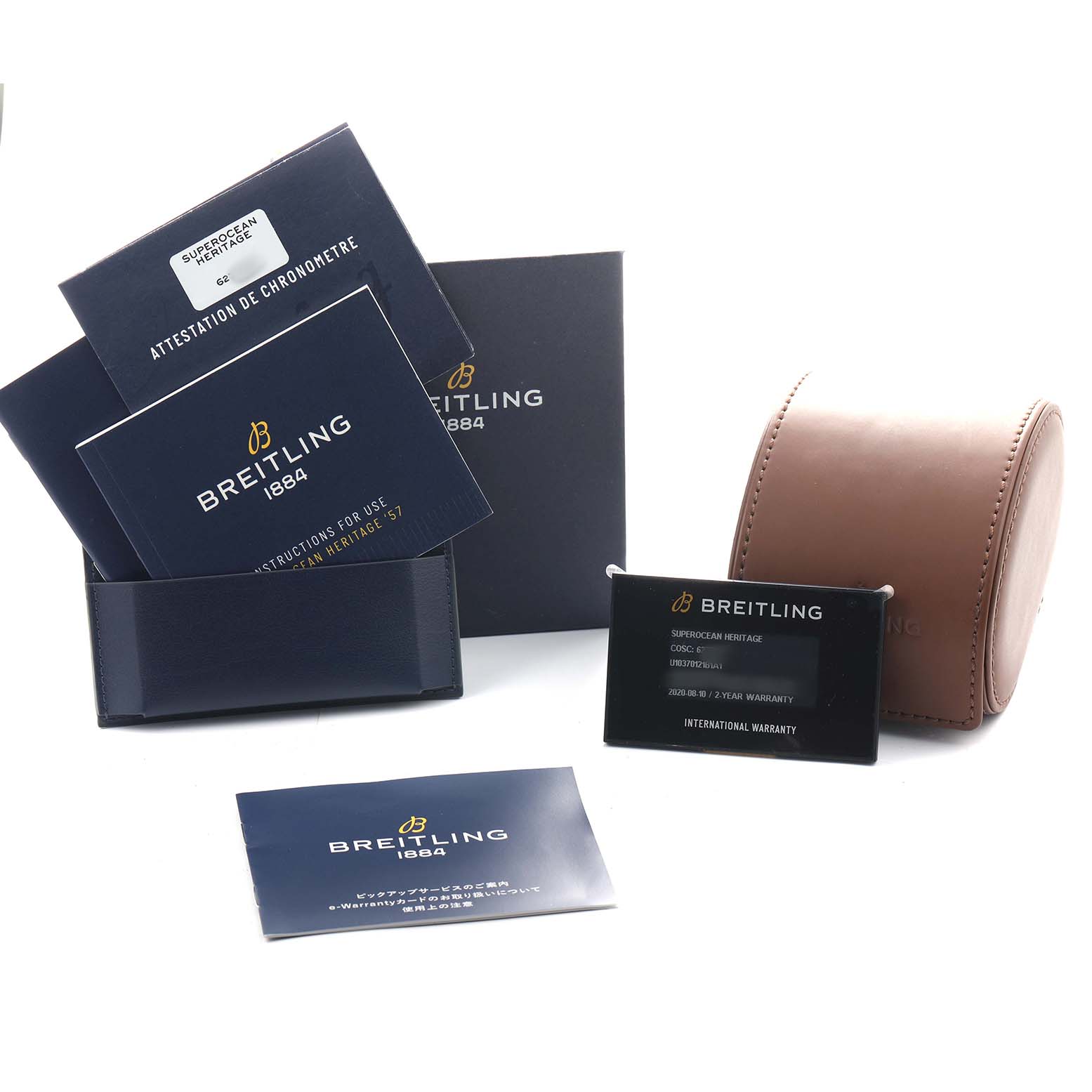 The image shows Breitling Superocean U10370121B1A1 Men's Stainless Steel Black Dial model documentation and accessories, including a watch box, warranty card, and manuals.