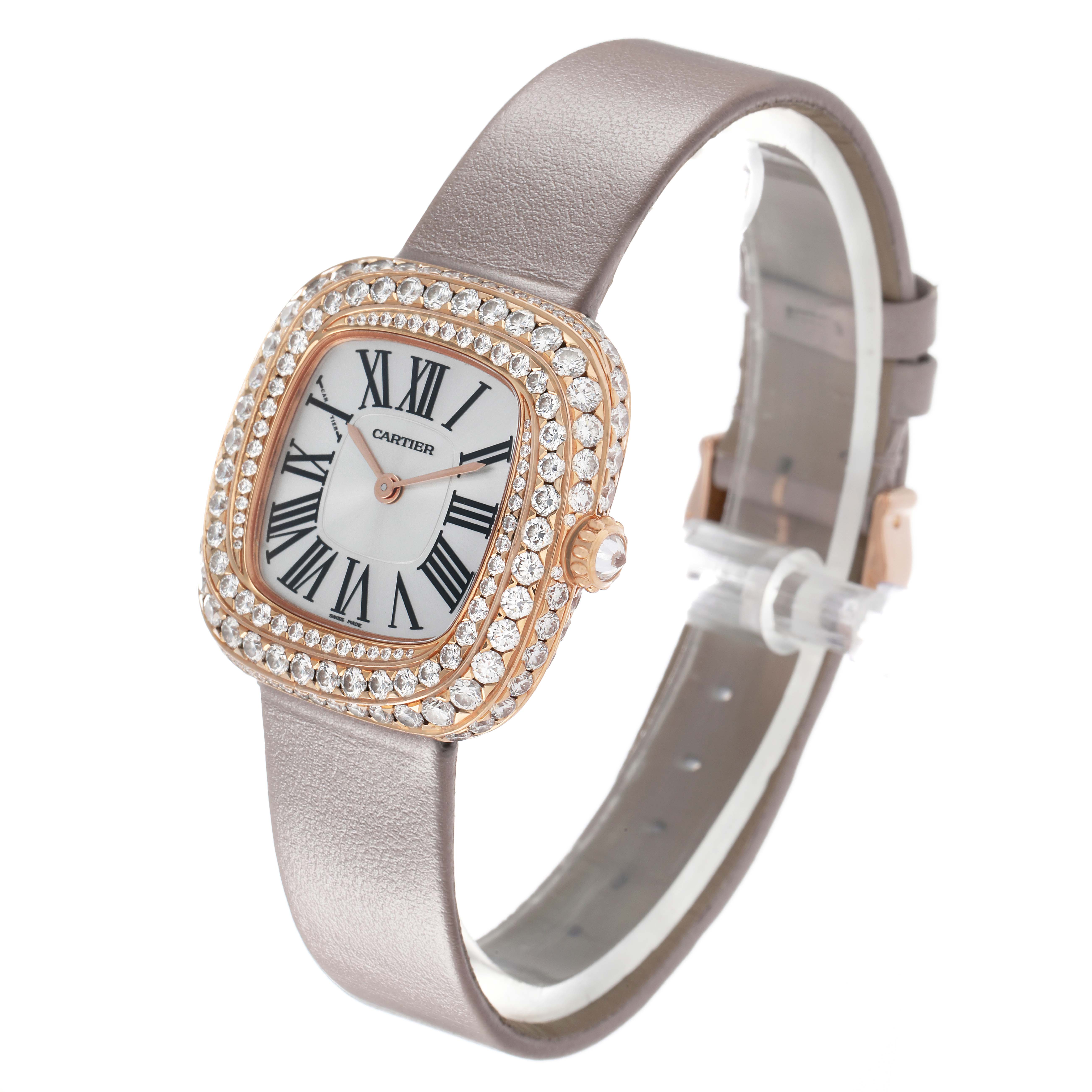 The Cartier Coussin WJCS0005 Women
s Rose Gold Silver Dial watch is shown at an oblique angle, highlighting the diamond-encrusted bezel and Roman numeral dial.