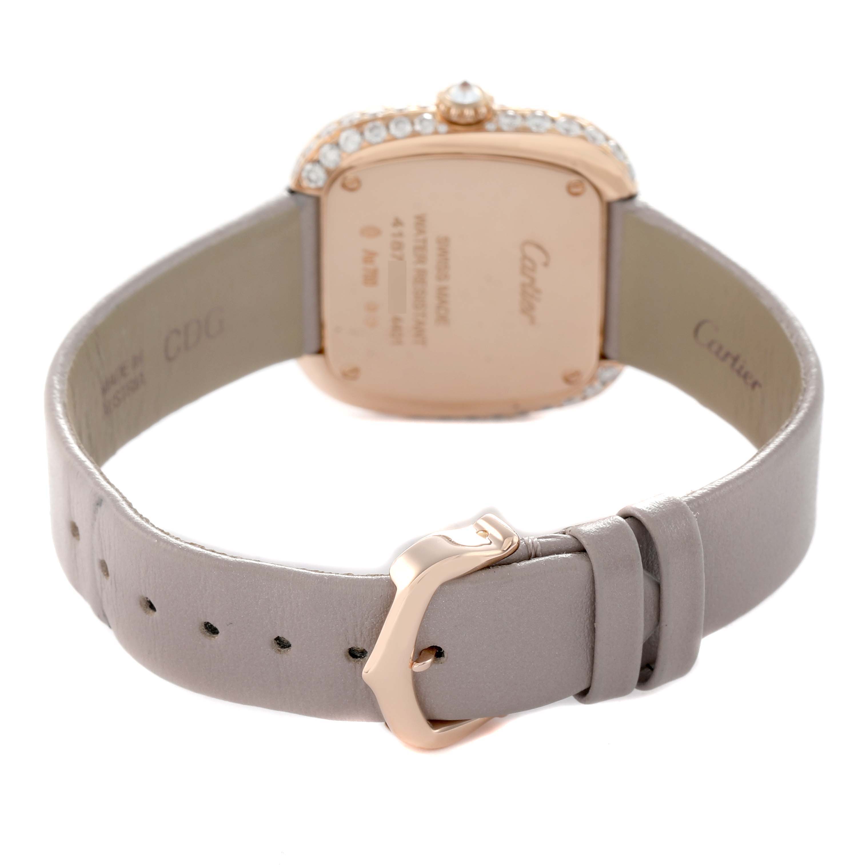 The image shows the Cartier Coussin WJCS0005 Women
s Rose Gold Silver Dial watch from the back, highlighting the case back, leather strap, and buckle details.