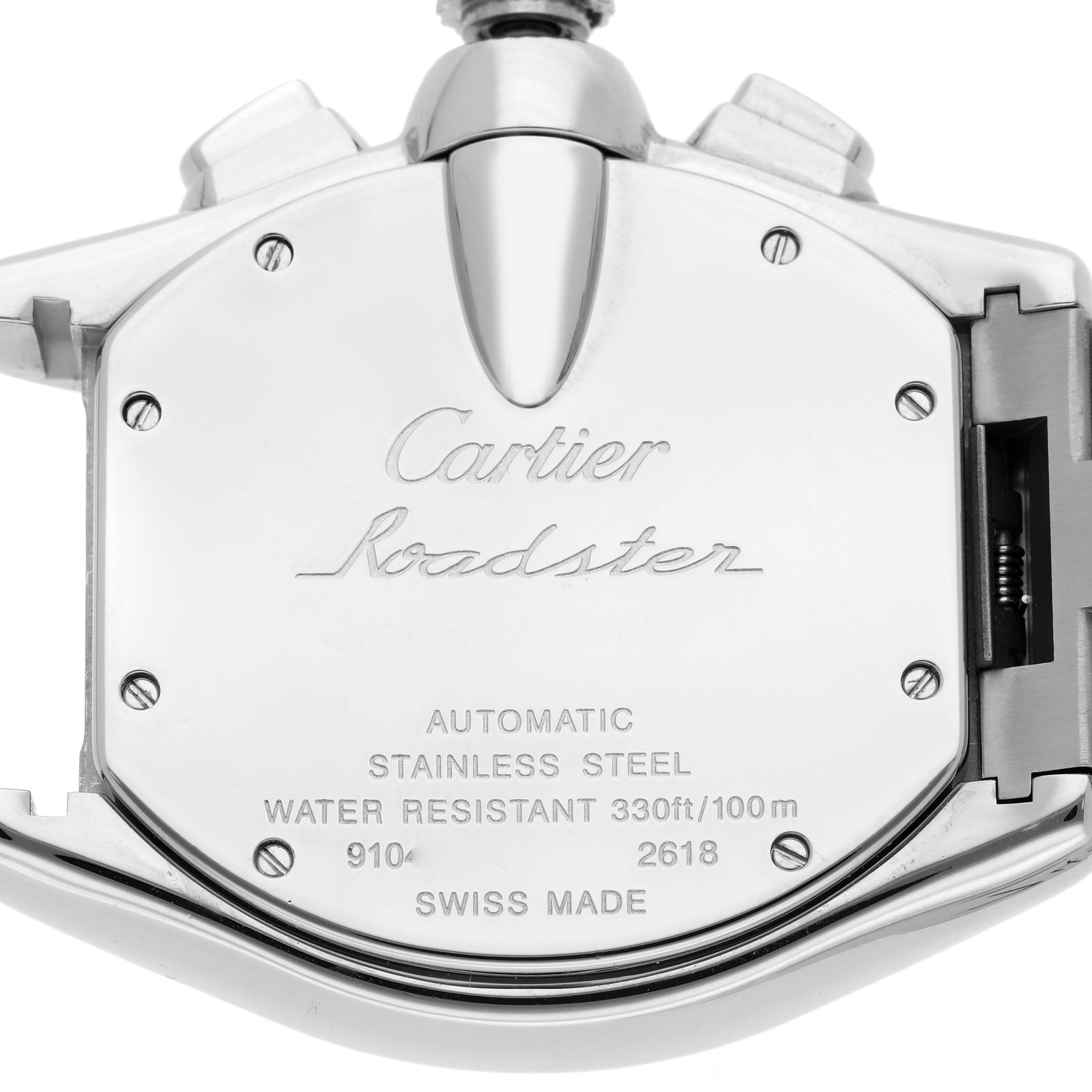 The image shows the back of a Cartier Roadster W62019X6 Men's Stainless Steel Silver Dial watch, highlighting the stainless steel case and engraved details.