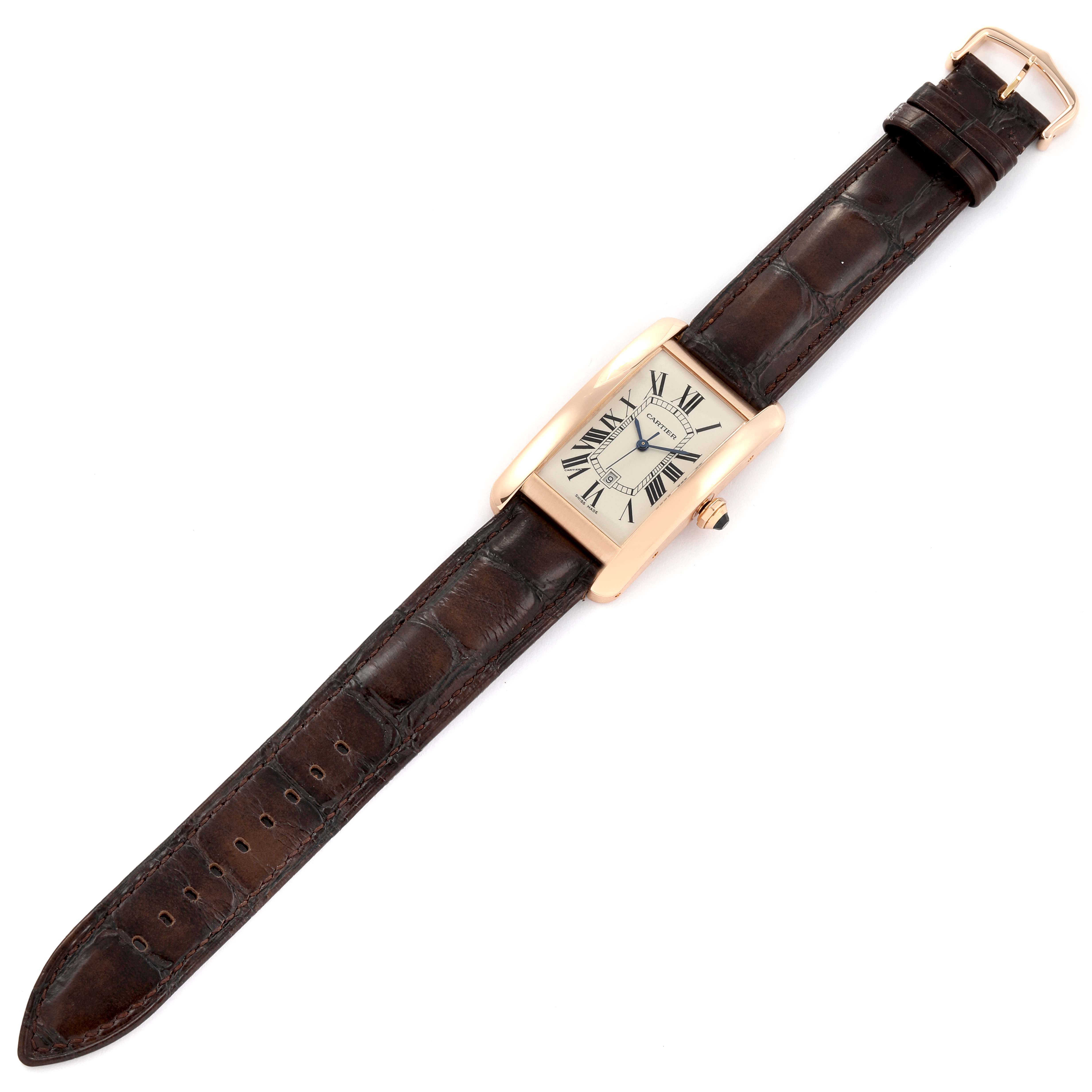 The image shows a Cartier Tank Americaine W2609156 Men
s Rose Gold Silver Dial W2609156 Men
s Rose Gold Silver Dial watch from a top-down angle, highlighting its rectangular face and brown leather strap.