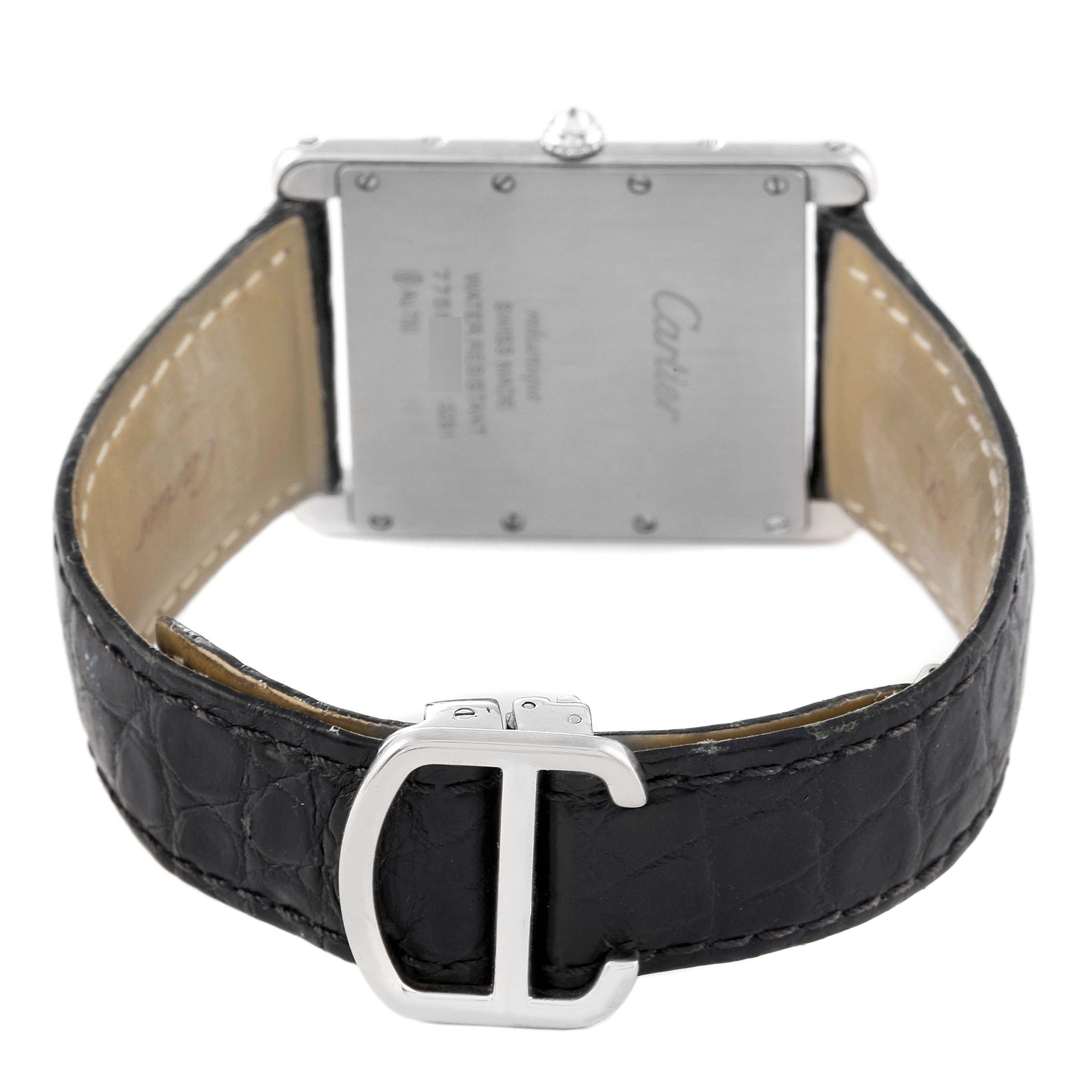 The image shows the back of the Cartier Tank Louis WT200006 Men's White Gold Silver Dial watch and the clasp of the strap from a slightly top-down angle.