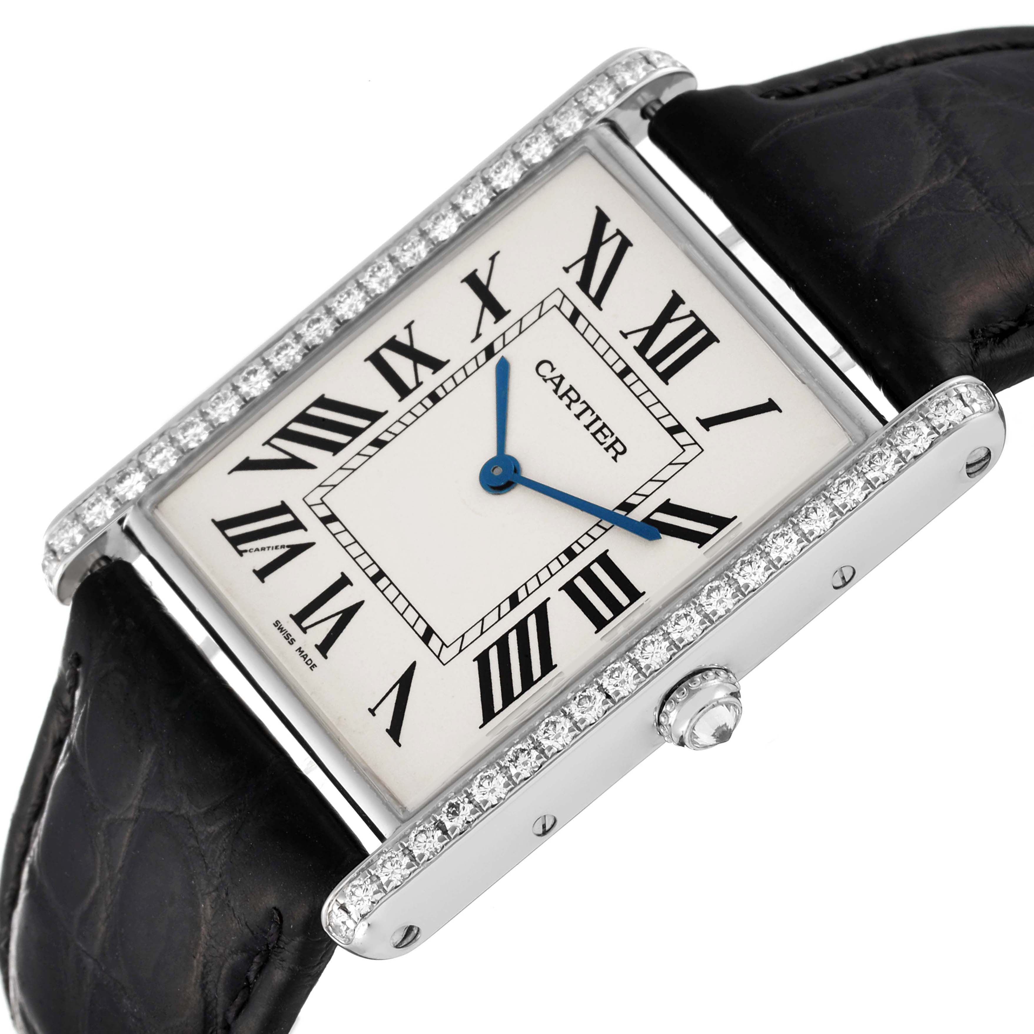 The Cartier Tank Louis WT200006 Men
s White Gold Silver Dial watch is shown at an angled view, highlighting the rectangular face, Roman numerals, diamond bezel, and leather strap.