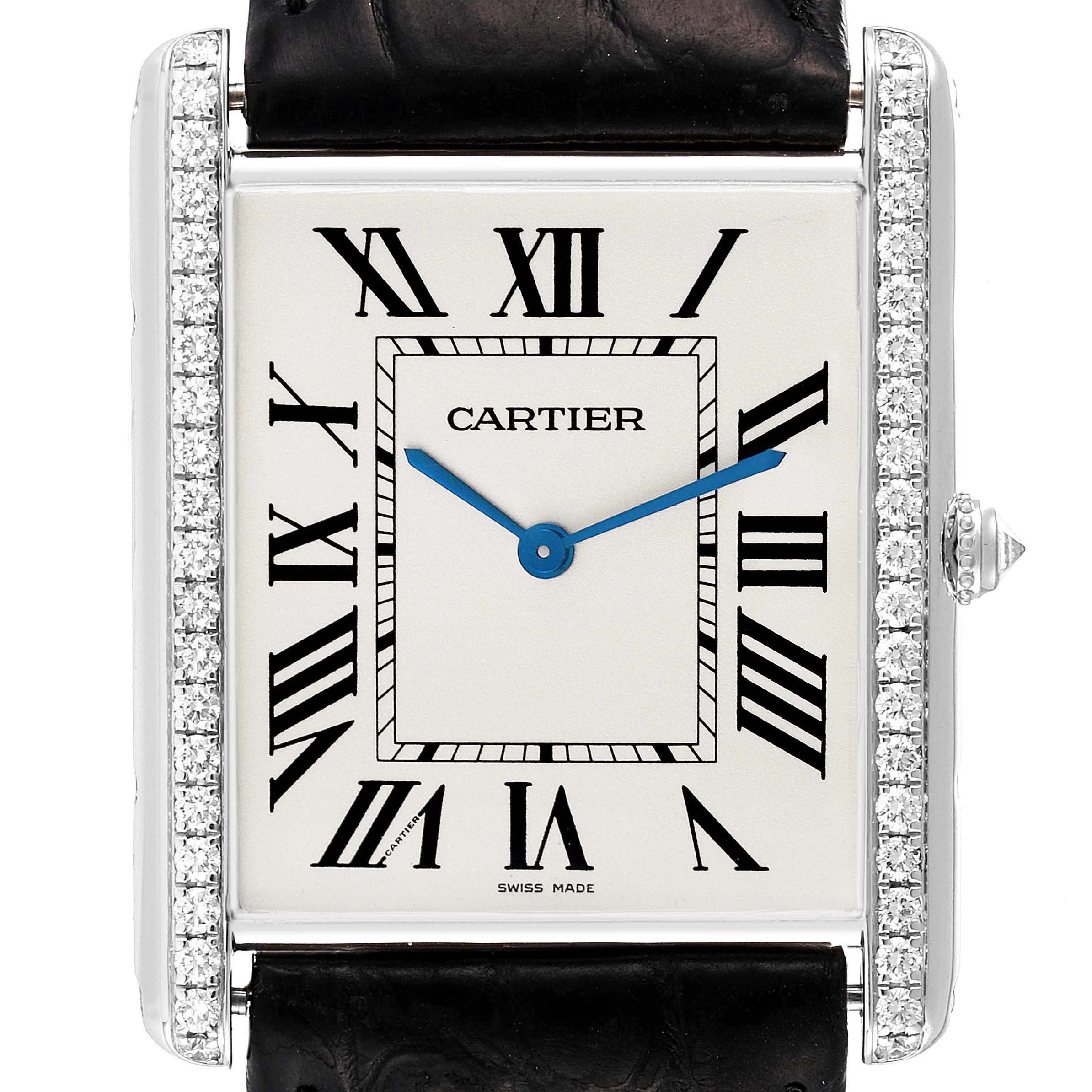 The Cartier Tank Louis WT200006 Men
s White Gold Silver Dial watch is shown from the front, highlighting its rectangular face, diamond-accented sides, and blue hands.