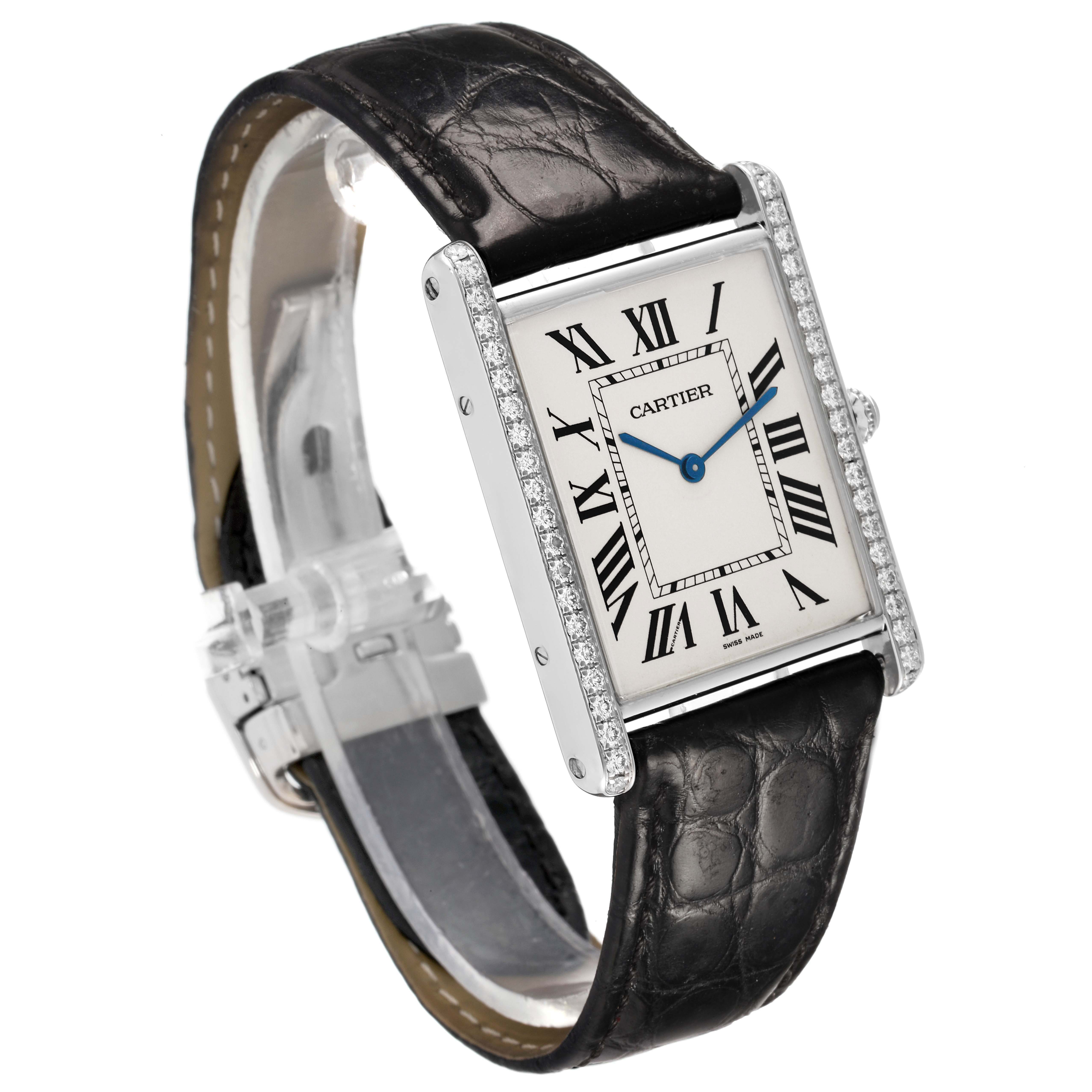 The Cartier Tank Louis WT200006 Men's White Gold Silver Dial watch is shown at an angle displaying the face, case, diamonds on the bezel, and leather strap.