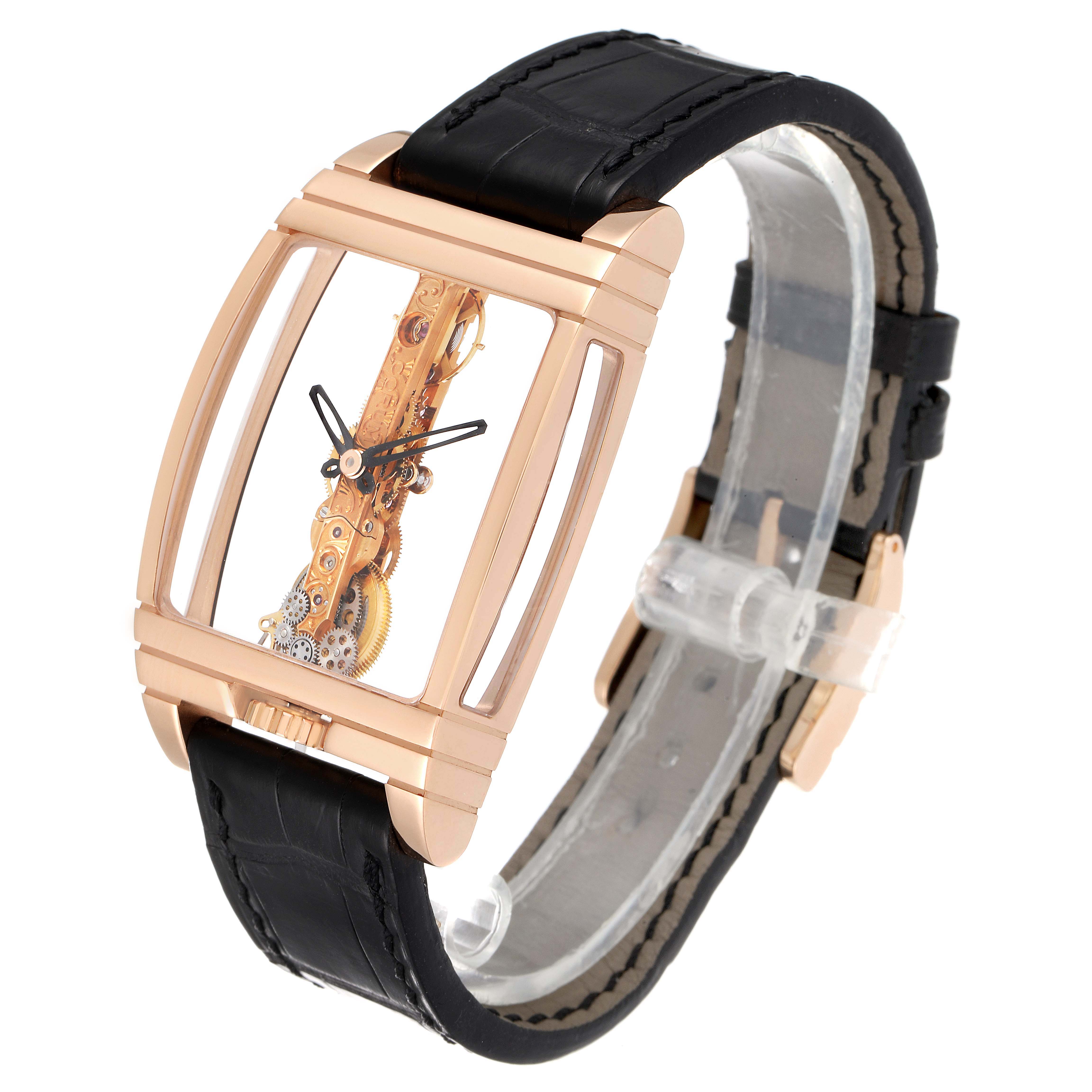 The Corum Golden Bridge B113/01043 - 113.160.55/0002 0000 Men's Rose Gold Transparent Dial watch is shown at a slight angled view, displaying its rectangular case and intricate movement.