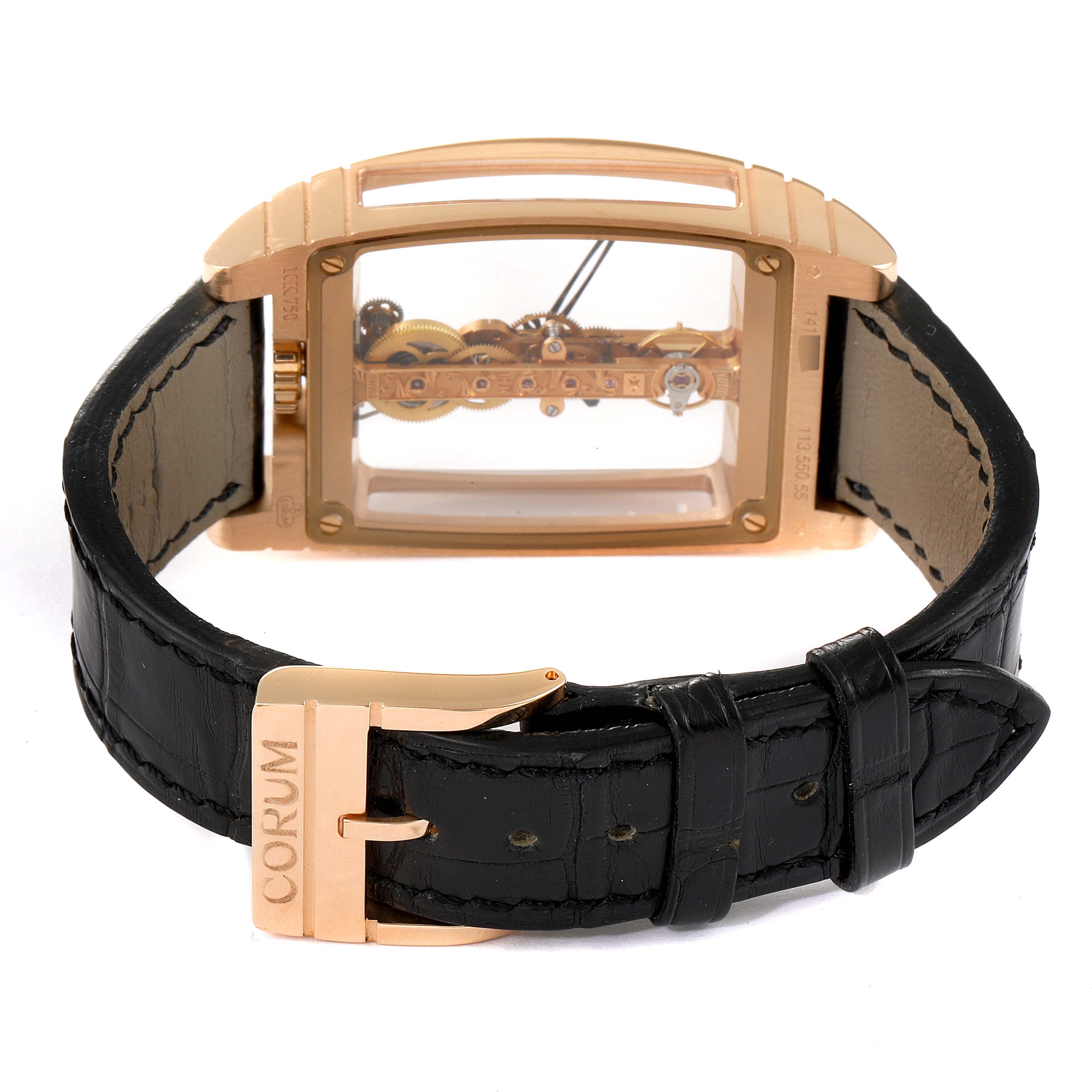 The image shows the back view of a Corum Golden Bridge B113/01043 - 113.160.55/0002 0000 Men's Rose Gold Transparent Dial B113/01043 - 113.160.55/0002 0000 Men's Rose Gold Transparent Dial watch, highlighting its transparent back and black leather strap with a branded buckle.