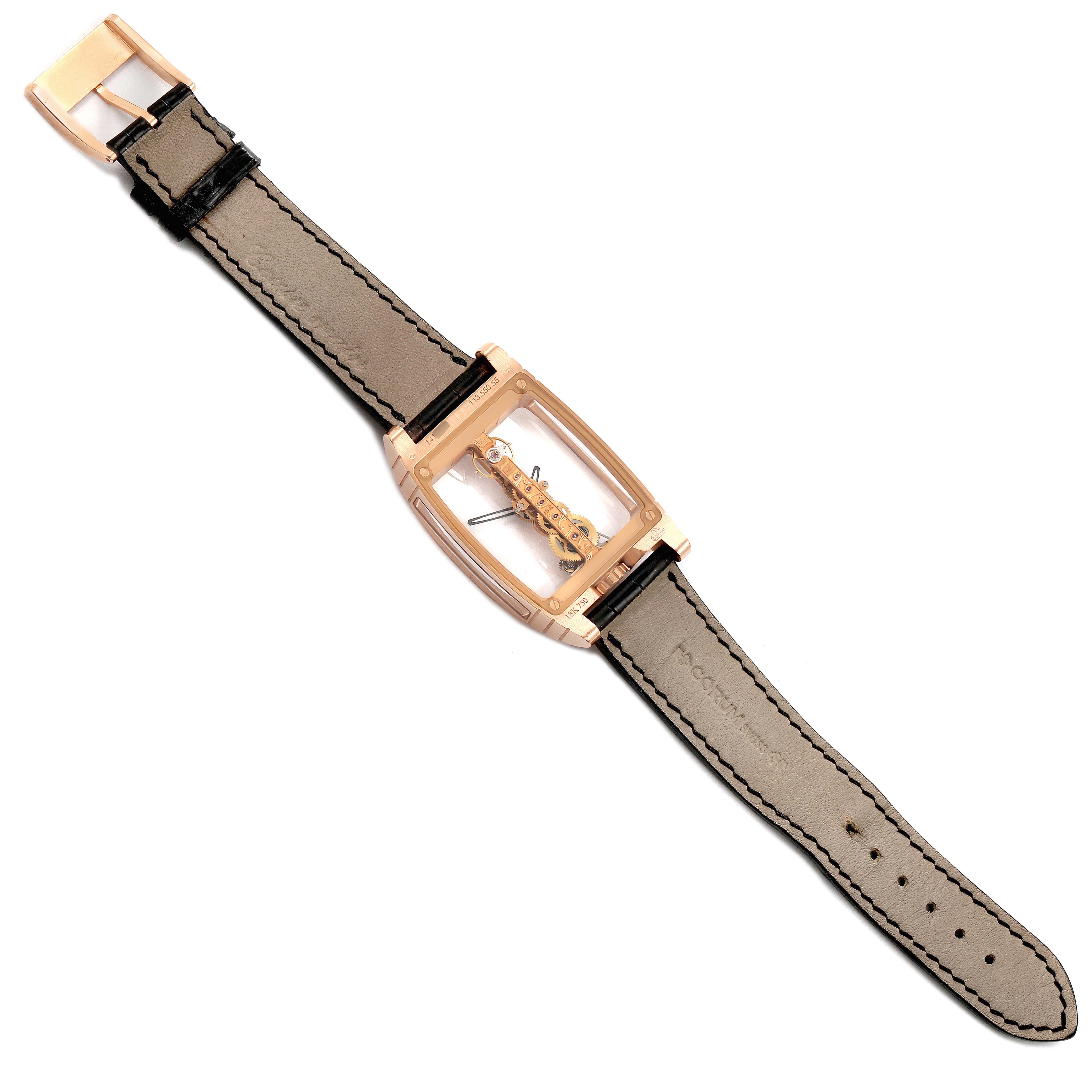 The Corum Golden Bridge B113/01043 - 113.160.55/0002 0000 Men's Rose Gold Transparent Dial watch is shown from a top-down view, highlighting its transparent case and leather strap.
