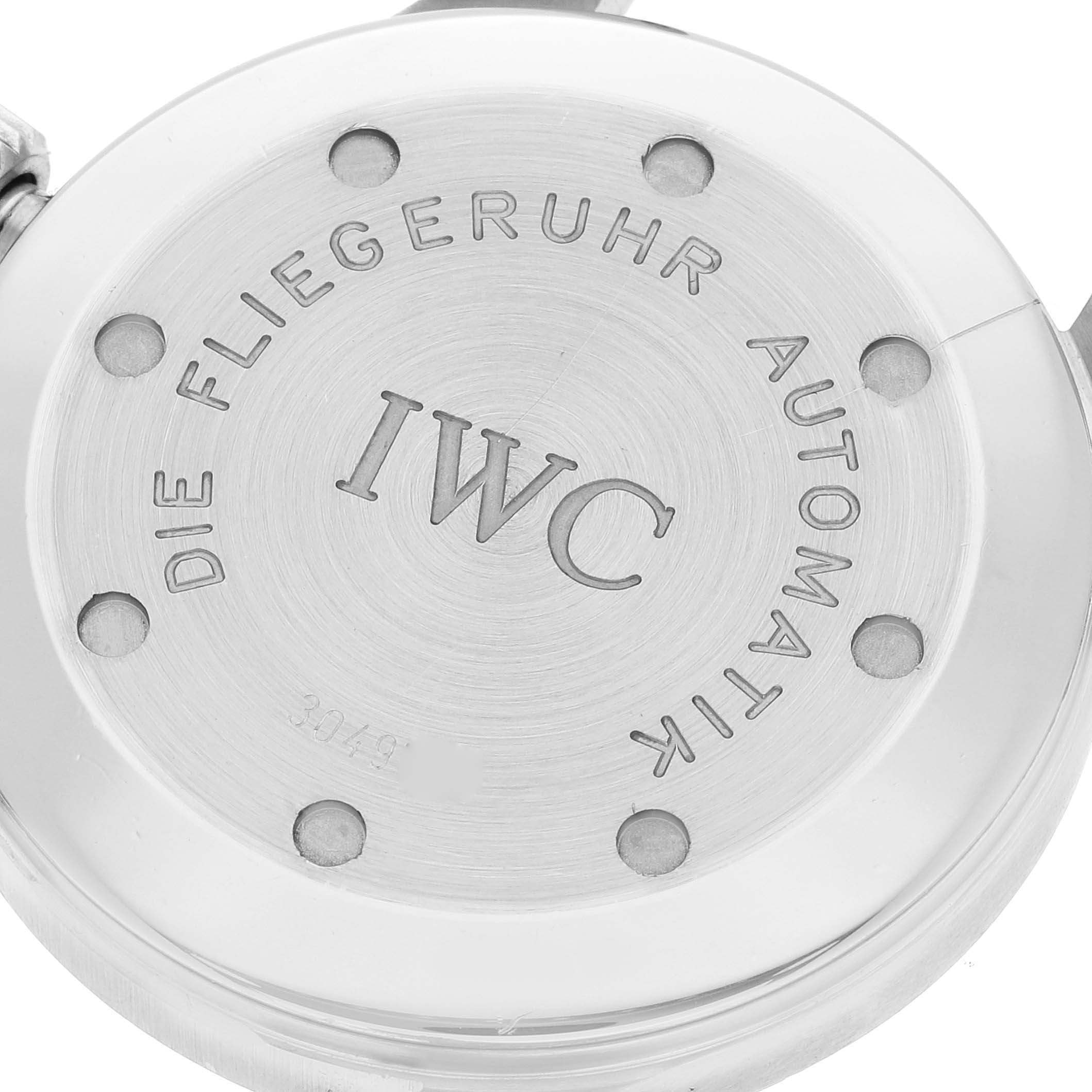 The image shows the back case of an IWC Pilot IW325311 Men's Stainless Steel Black Dial IW325311 Men's Stainless Steel Black Dial model watch with the brand and model text engraved.