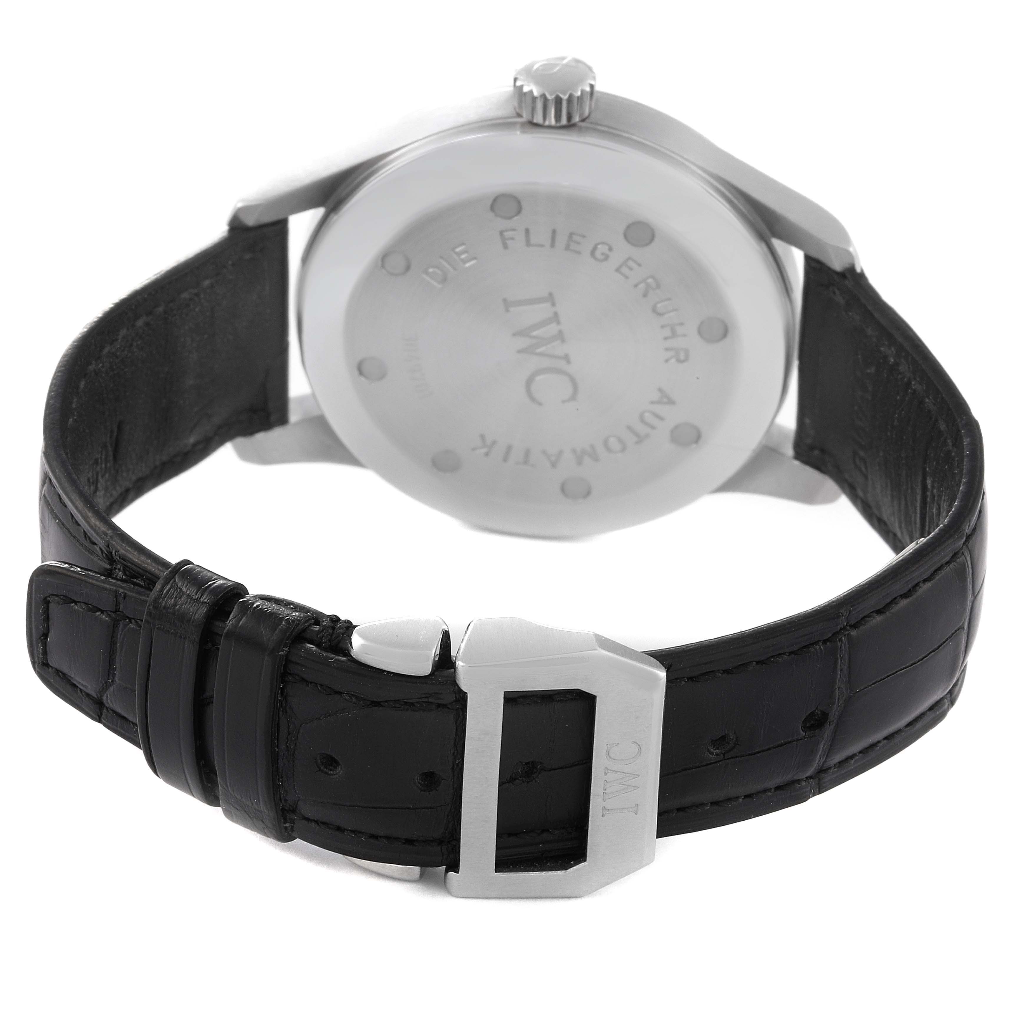 The image shows the back view of the IWC Pilot IW325311 Men's Stainless Steel Black Dial IW325311 Men's Stainless Steel Black Dial model watch, highlighting its clasp, leather strap, and case back.