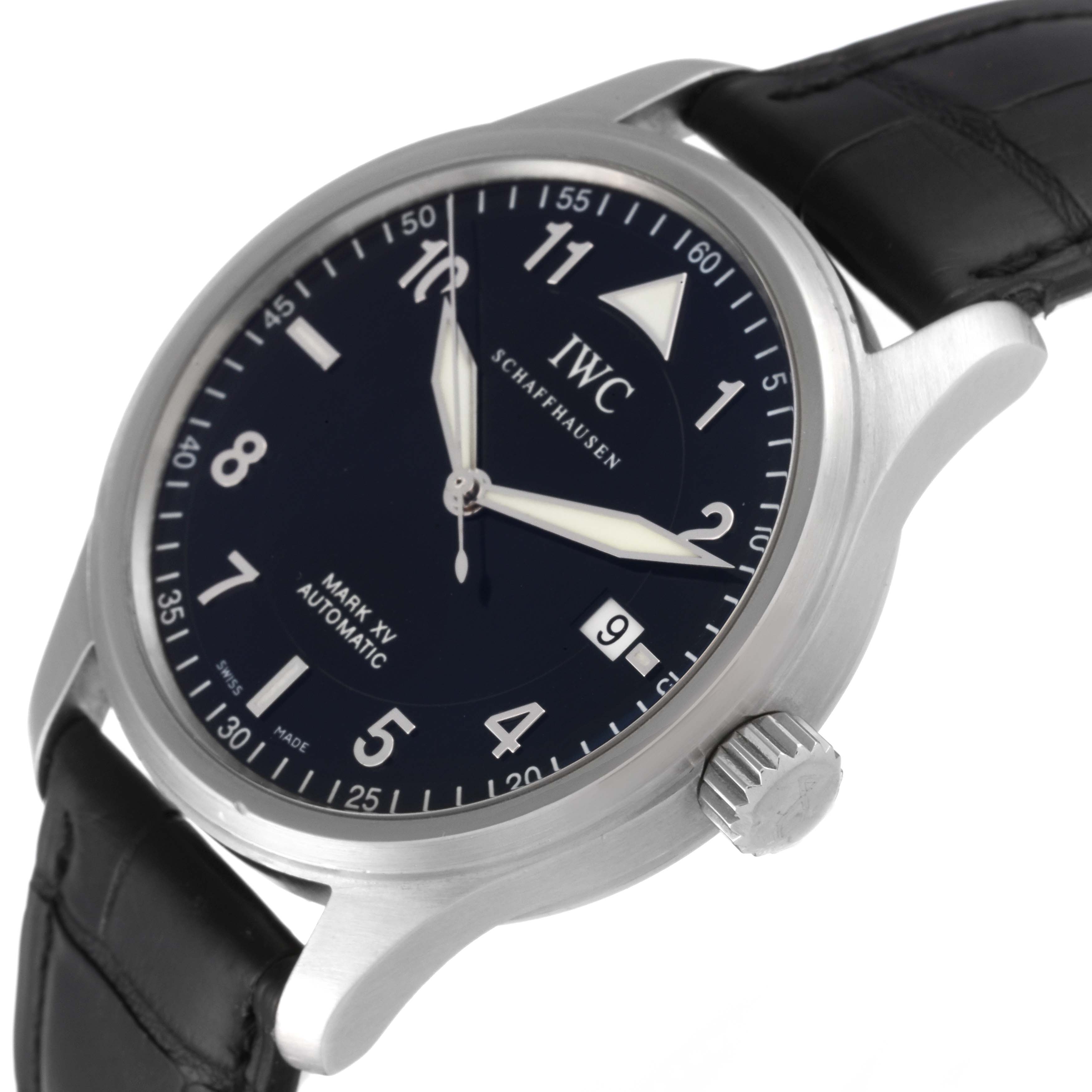 The image shows an angled close-up view of the IWC Pilot IW325311 Men's Stainless Steel Black Dial IW325311 Men's Stainless Steel Black Dial Mark XV watch, displaying its dial, crown, and part of the leather strap.