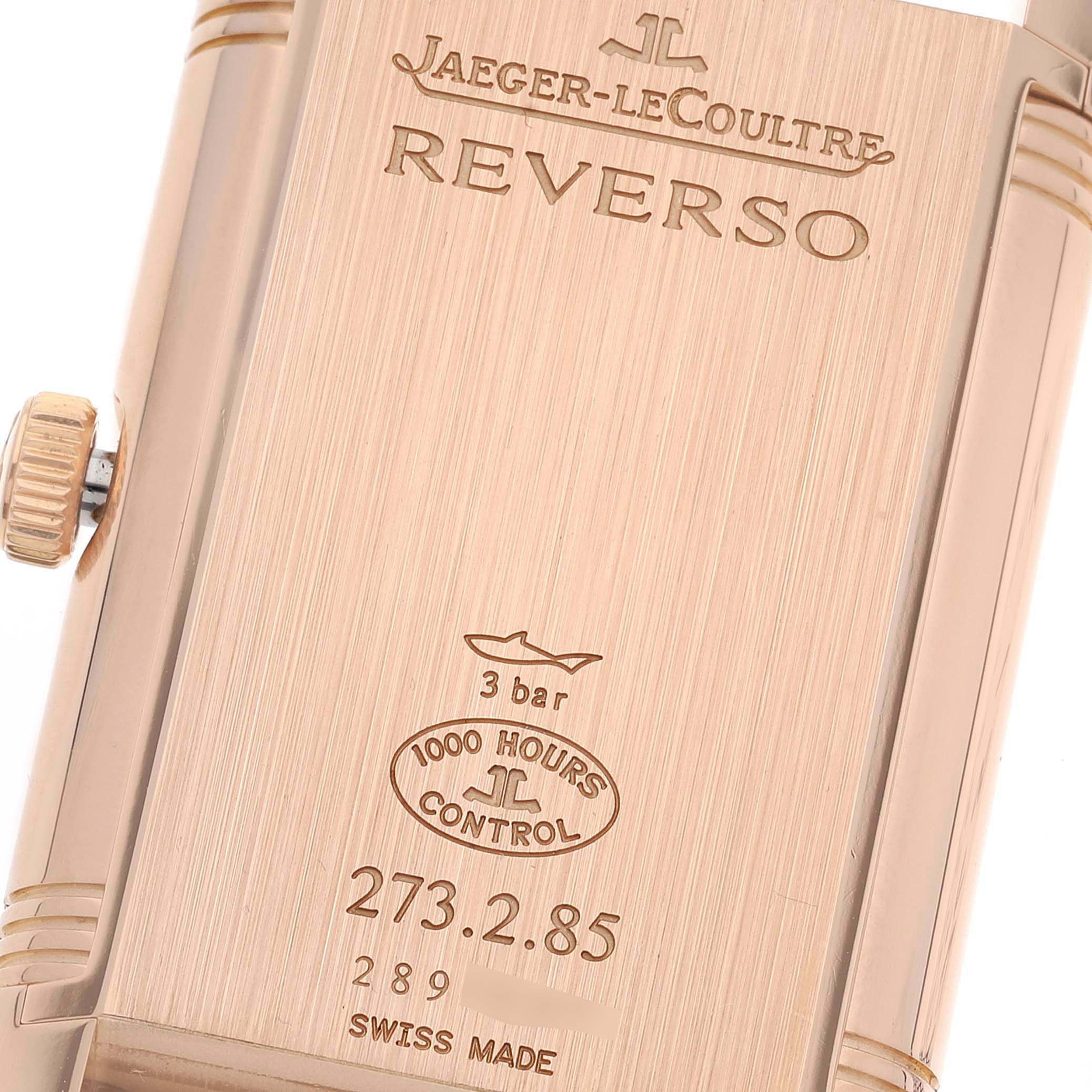 The image shows the back case of the Jaeger LeCoultre Reverso Q3742521 Men's Rose Gold Silver Dial Q3742521 Men's Rose Gold Silver Dial watch, featuring engravings and the crown.