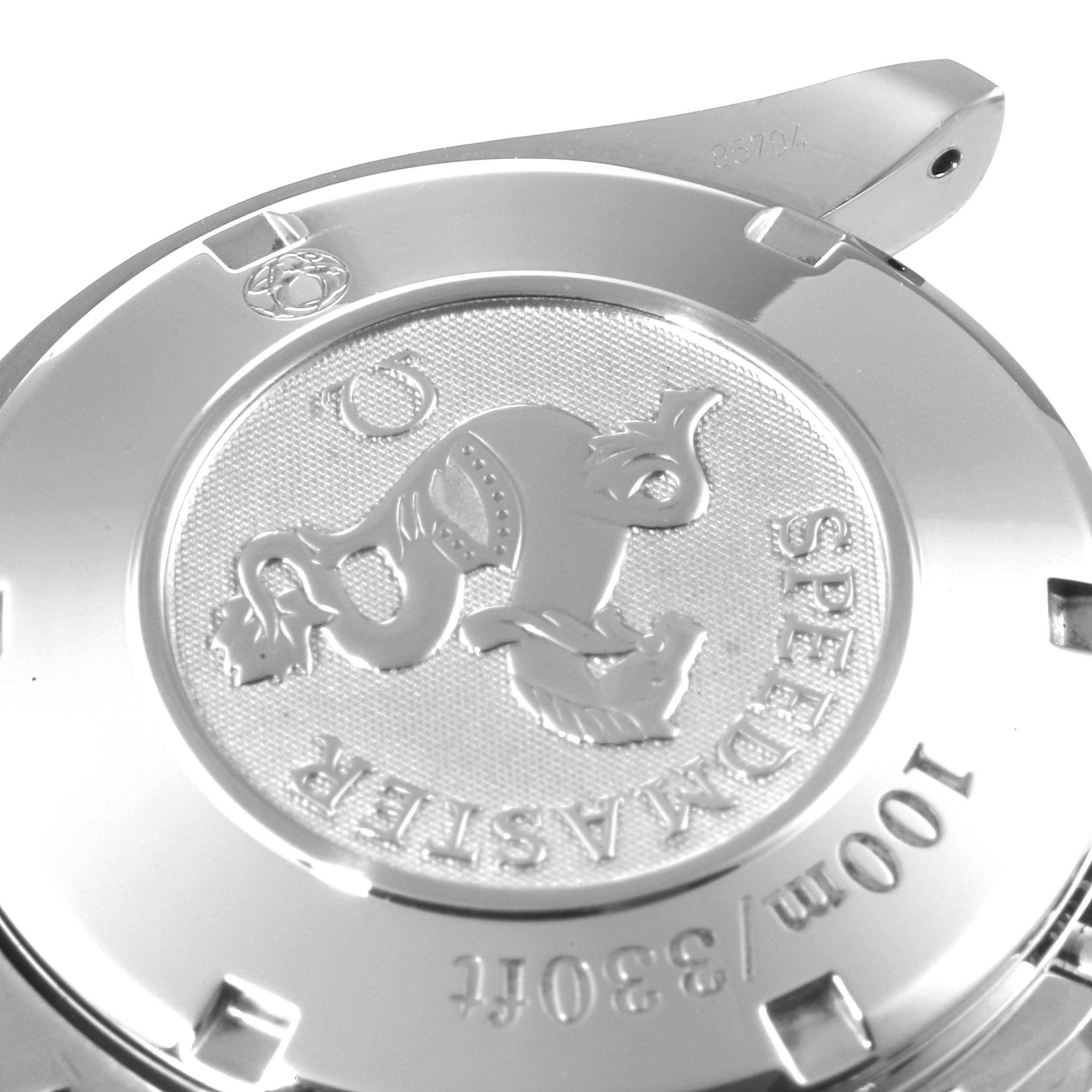 The image shows the back case of an Omega Speedmaster 3210.51.00 Men
s Stainless Steel Black Dial 3210.51.00 Men
s Stainless Steel Black Dial watch, highlighting the engraved logo and specifications.