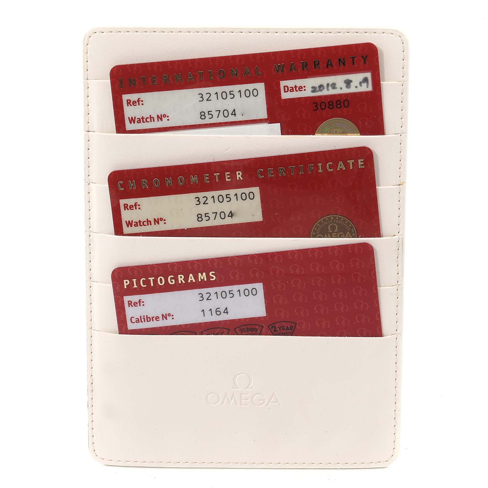 The image shows an Omega Speedmaster 3210.51.00 Men
s Stainless Steel Black Dial 3210.51.00 Men
s Stainless Steel Black Dial model cardholder with International Warranty, Chronometer Certificate, and Pictograms cards.