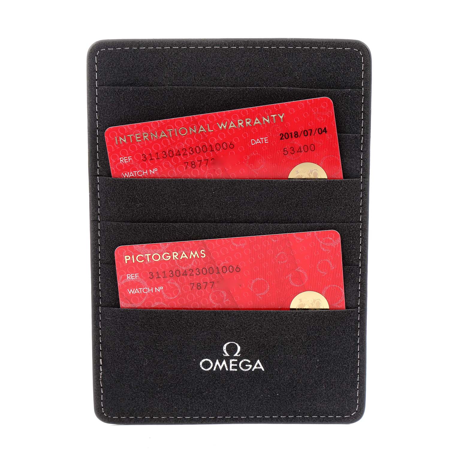 The image shows an International Warranty and Pictograms cards for an Omega Speedmaster 311.30.42.30.01.006 Men's Stainless Steel Black Dial 311.30.42.30.01.006 Men's Stainless Steel Black Dial watch, placed in a black cardholder.