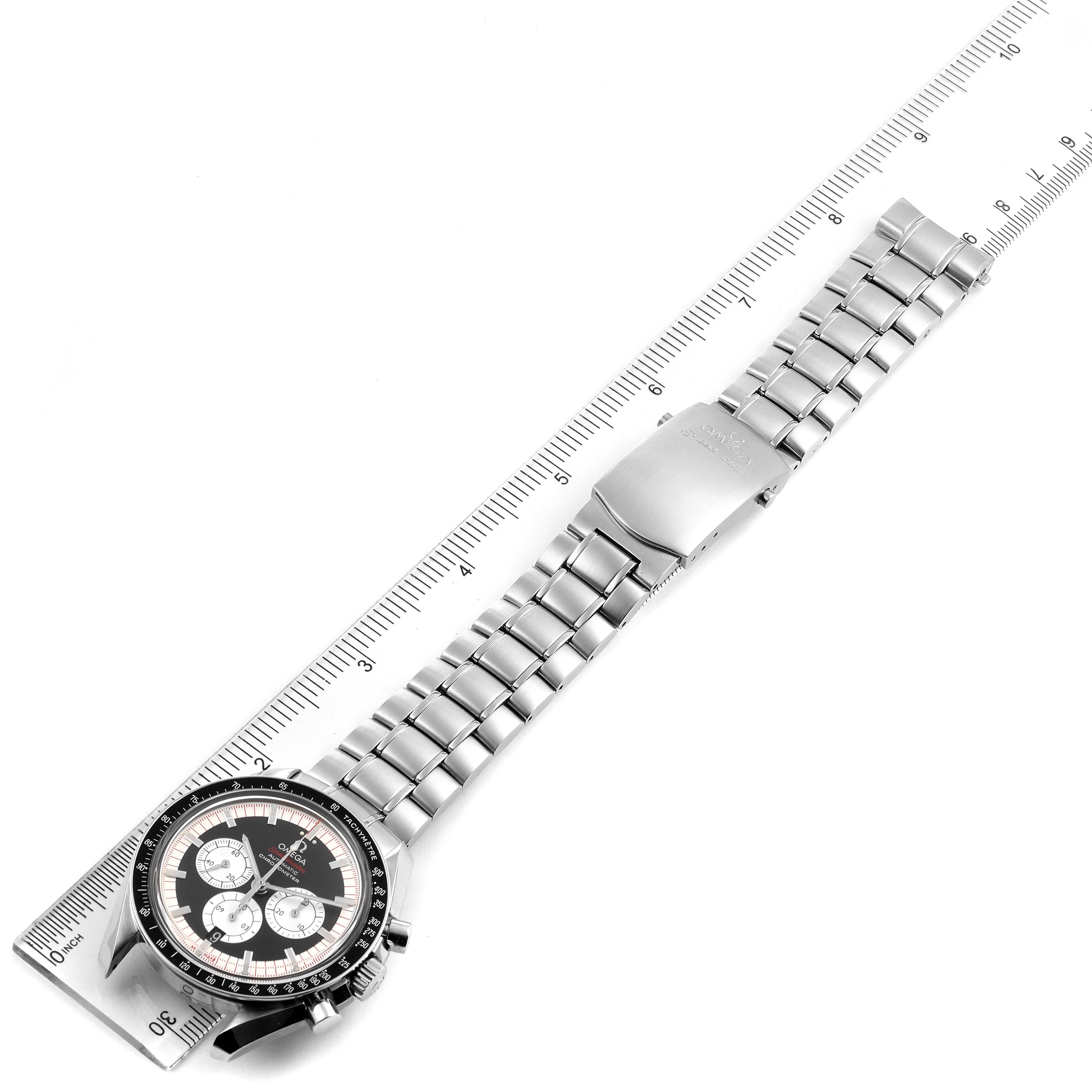 The Omega Speedmaster 3507.51.00 Men's Stainless Steel Black Dial 3507.51.00 Men's Stainless Steel Black Dial watch is shown from an overhead angle, displaying the dial, bezel, and entire bracelet alongside a ruler.