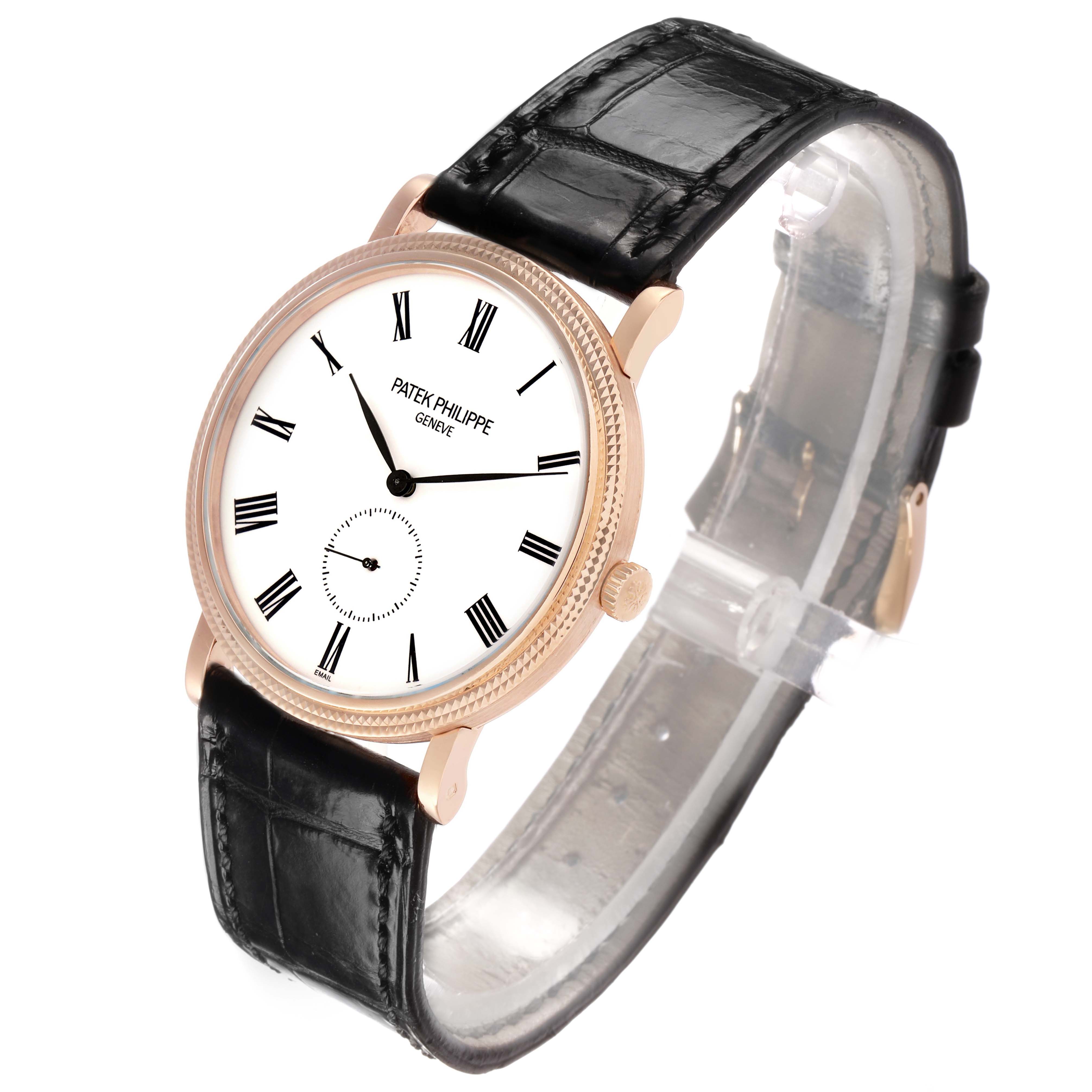 The Patek Philippe Calatrava 5116R Men's Rose Gold White Dial watch is shown at a three-quarter angle, highlighting its face, bezel, crown, and black leather strap.