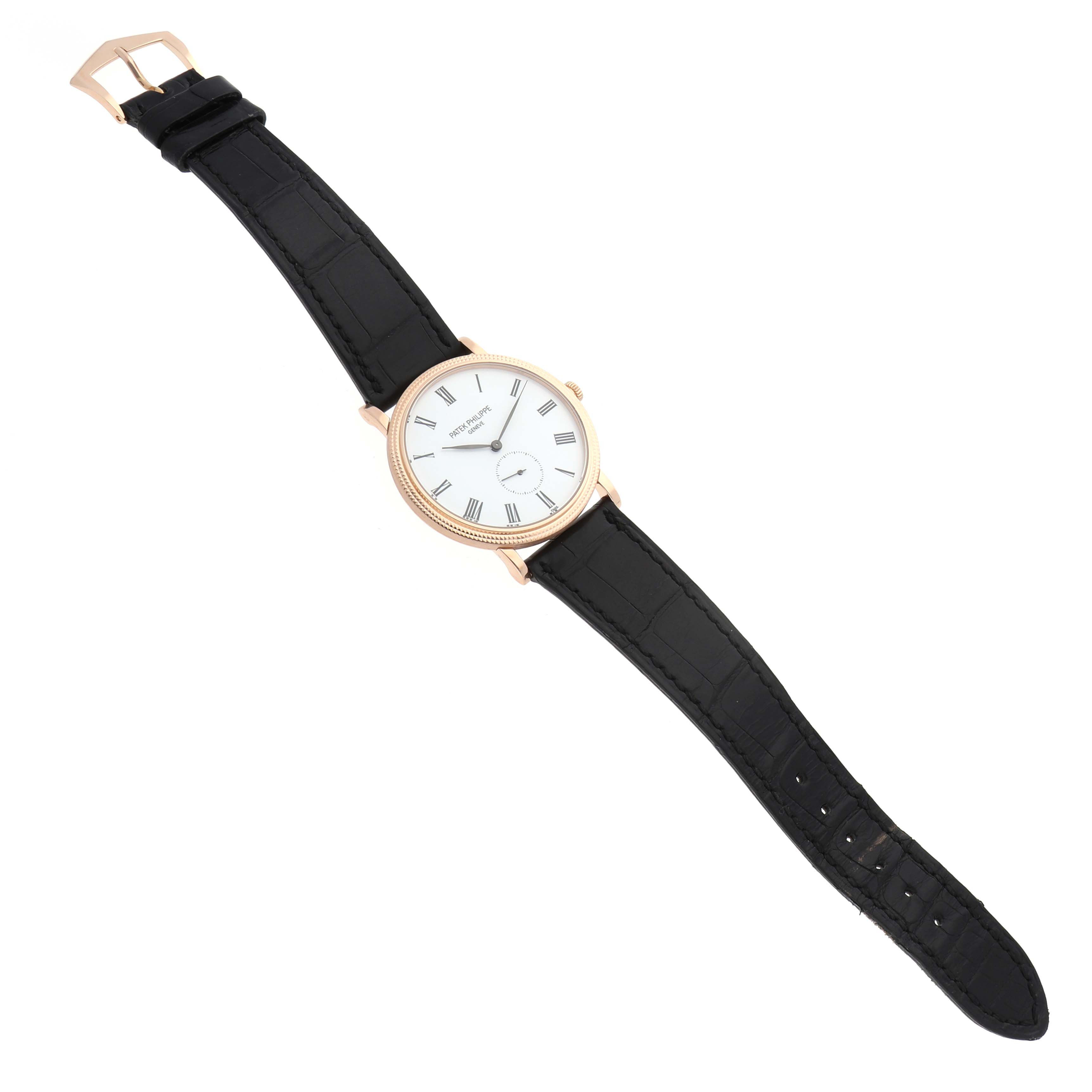 The Patek Philippe Calatrava 5116R Men's Rose Gold White Dial watch is shown from an angled top view, displaying the face, case, and black leather strap.