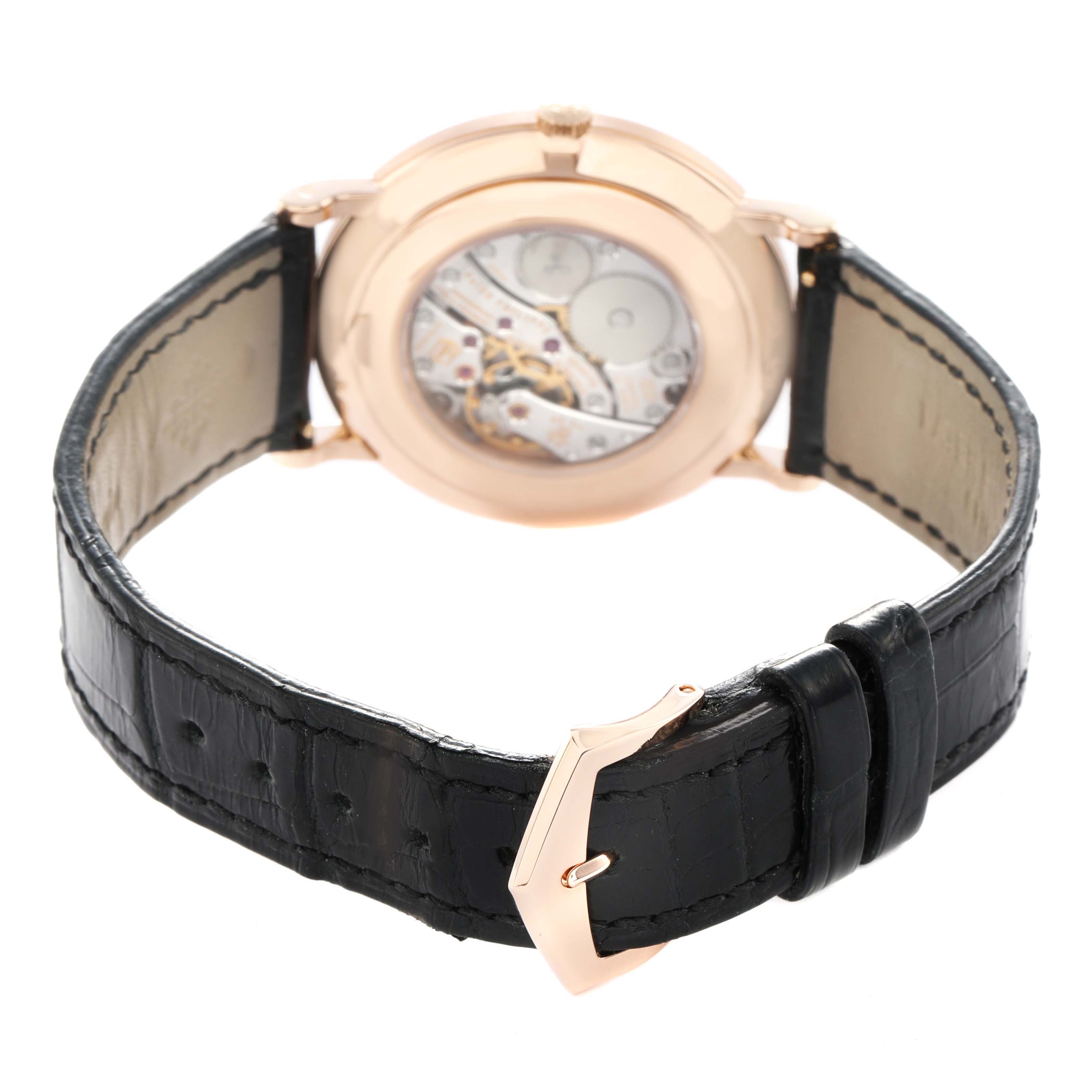 The image shows the back view of a Patek Philippe Calatrava 5116R Men's Rose Gold White Dial watch, highlighting the movement and black leather strap.