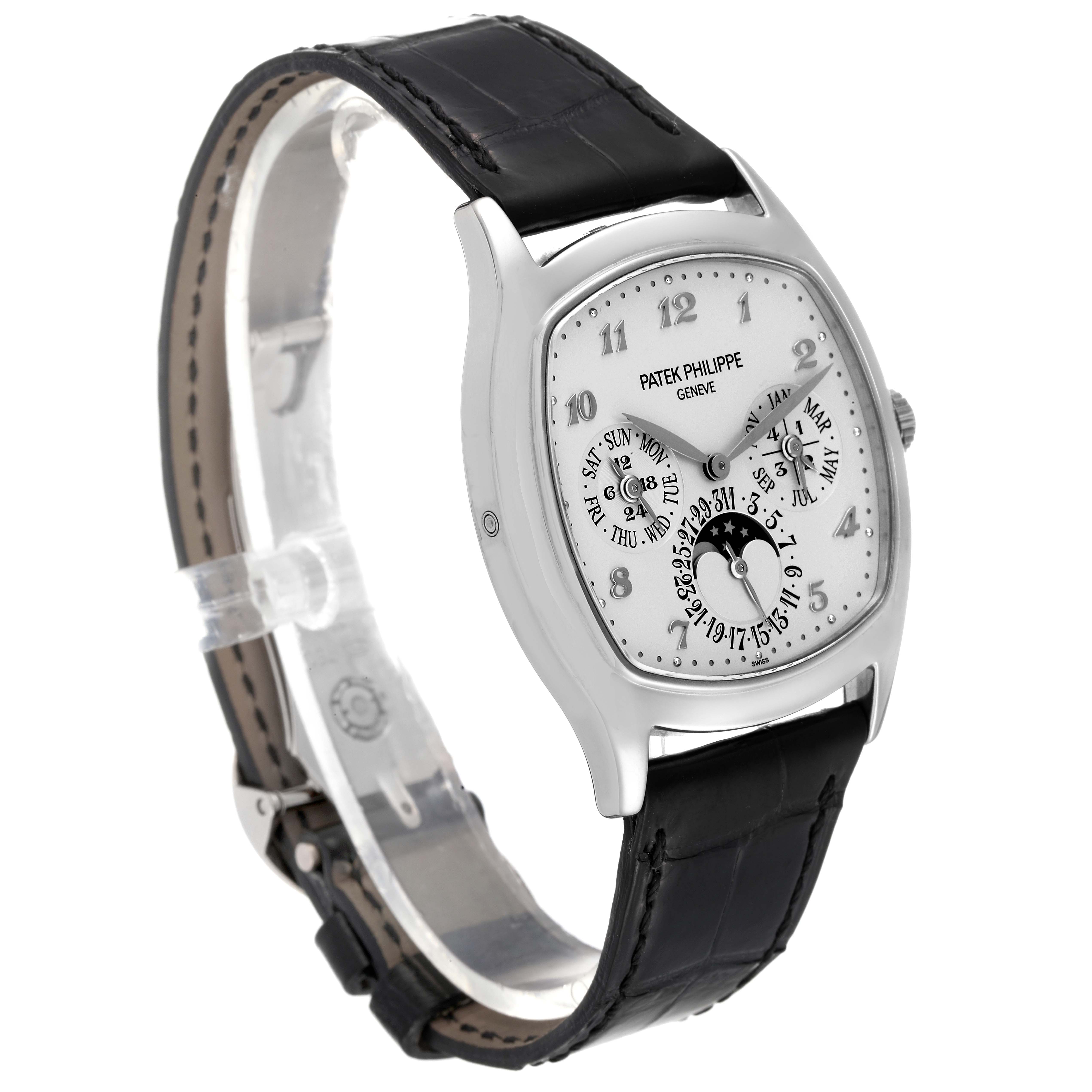 The image shows a side angle of a Patek Philippe Complications 5940G - 001 Men's White Gold Silver Dial 5940G - 001 Men's White Gold Silver Dial watch, highlighting its dial, case, crown, and strap.