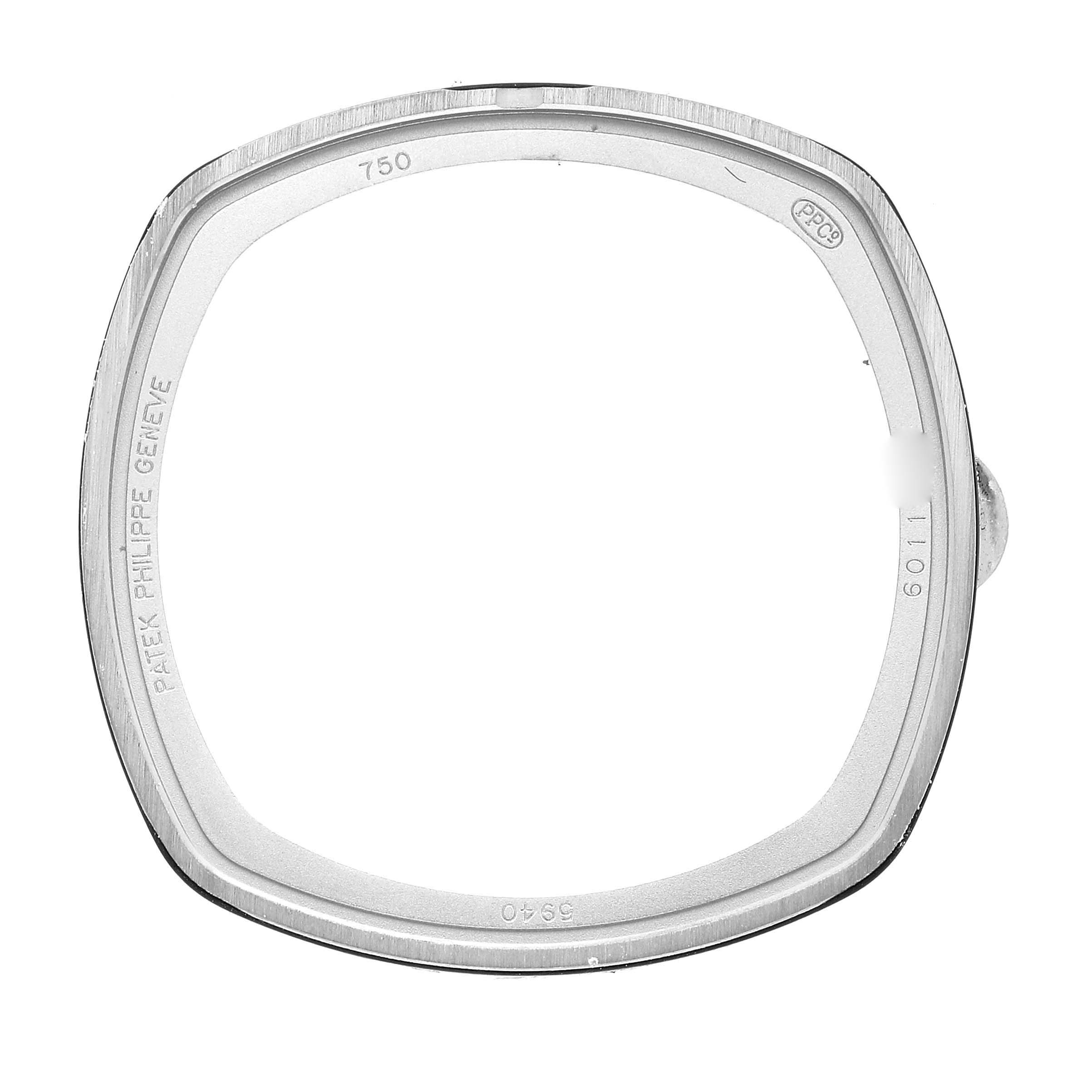 This is a close-up image of the bezel frame for a Patek Philippe Complications 5940G - 001 Men's White Gold Silver Dial 5940G - 001 Men's White Gold Silver Dial model watch.