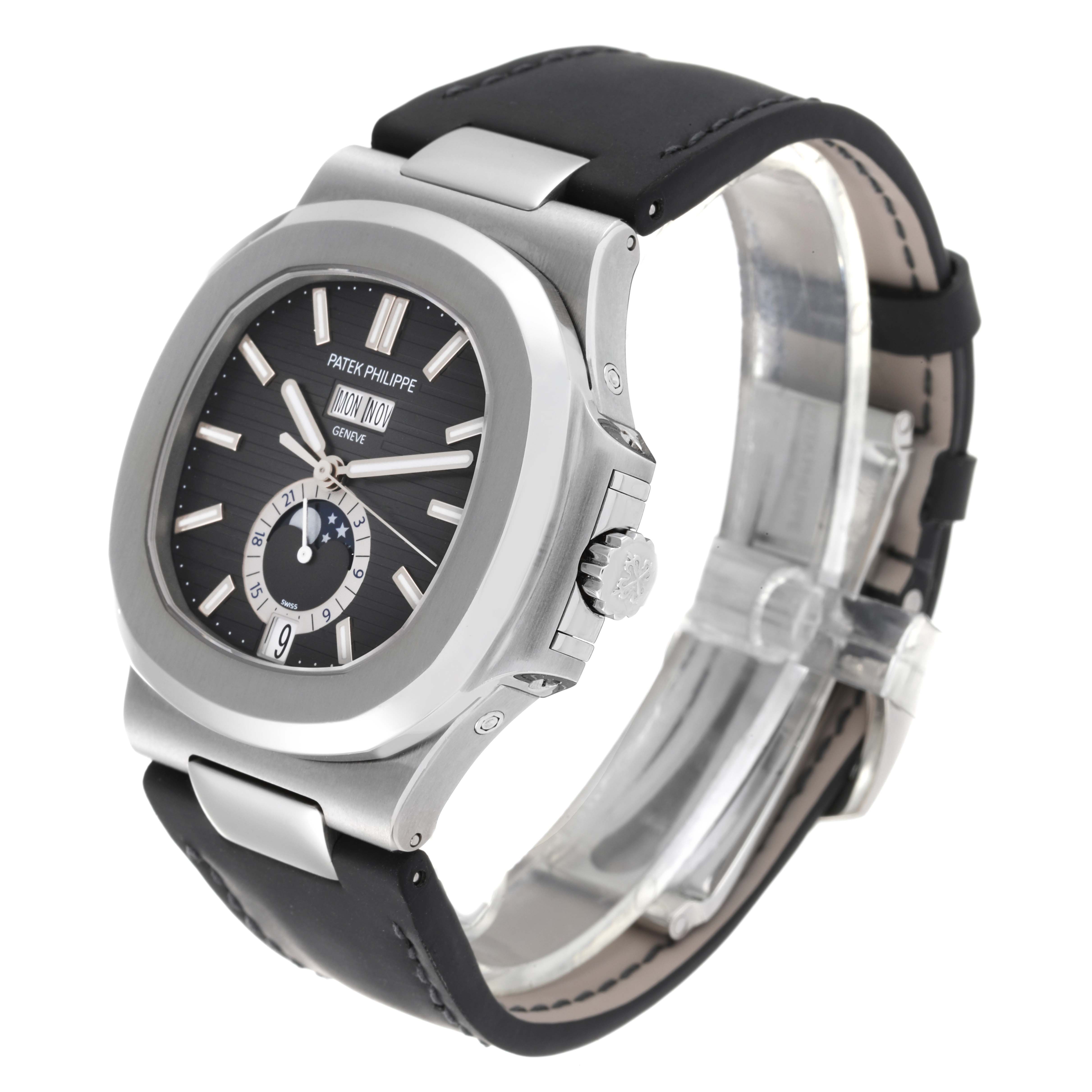 The image shows a Patek Philippe Nautilus 5726A-001 Men
s Stainless Steel Black Dial 5726A-001 Men
s Stainless Steel Black Dial watch at a three-quarter angle, highlighting its black dial, bezel, crown, and strap.