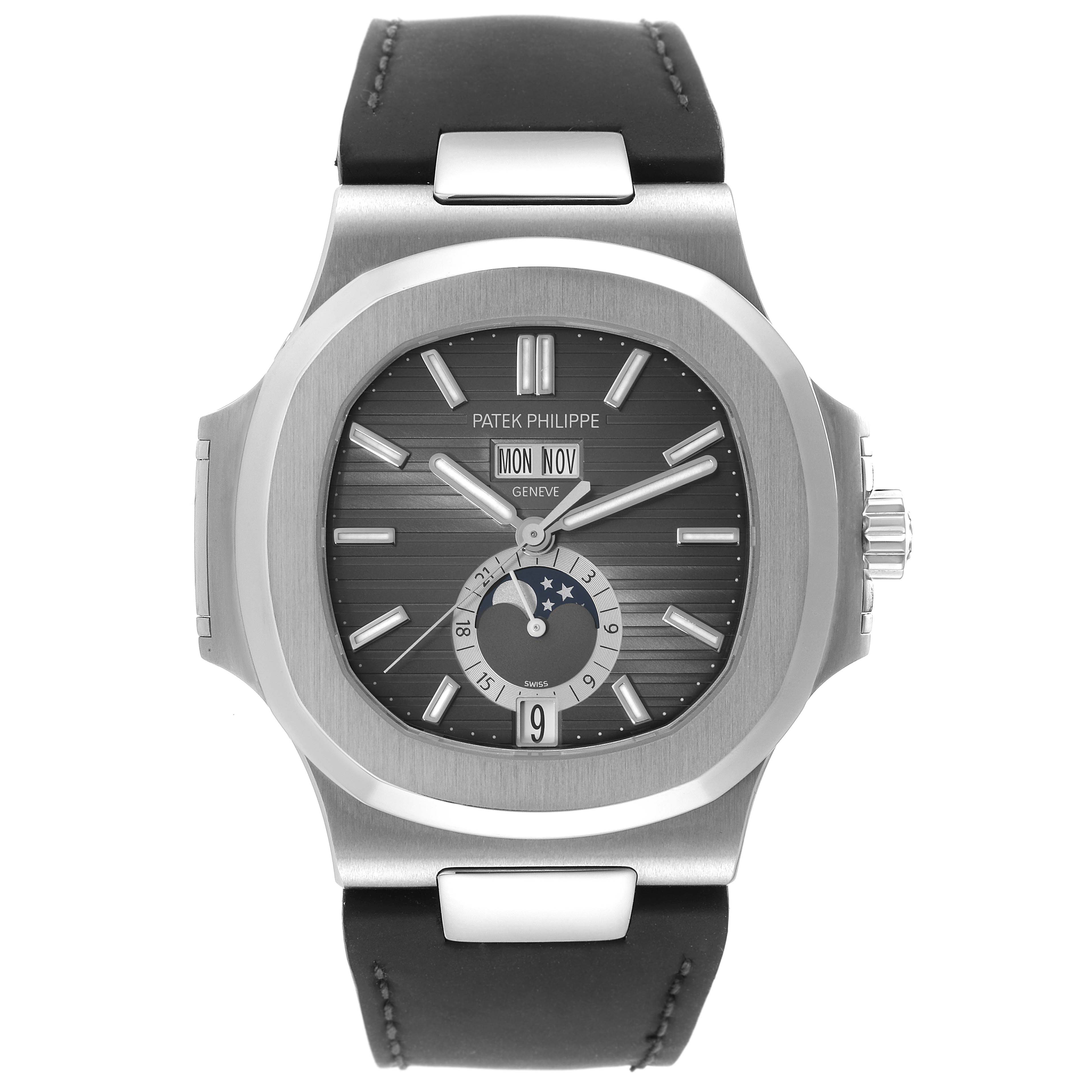 The image shows a front view of a Patek Philippe Nautilus 5726A-001 Men
s Stainless Steel Black Dial 5726A-001 Men
s Stainless Steel Black Dial watch, displaying the dial, hands, date, and moon phase indicators.