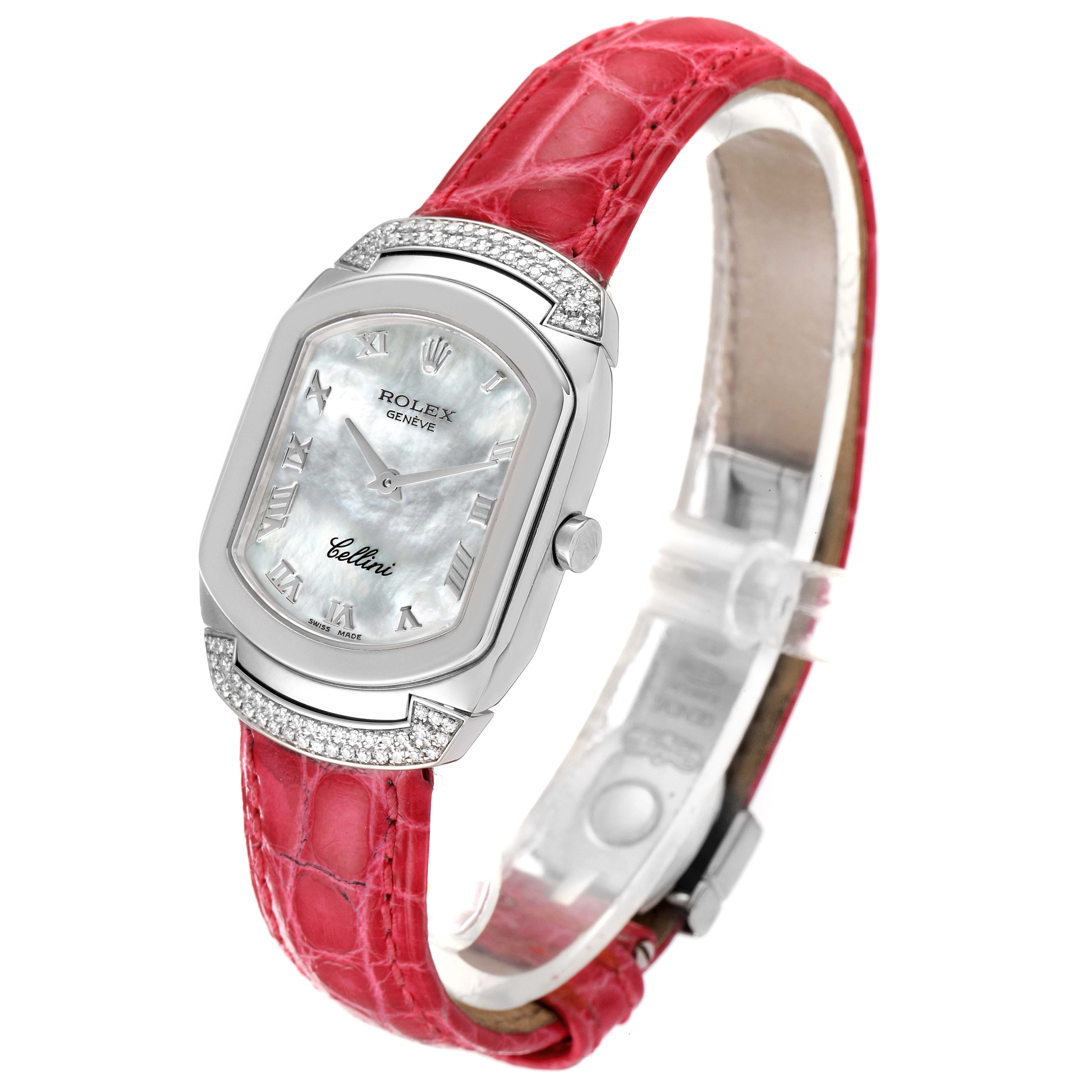 The Rolex Cellini 6692 Women's White Gold Mother of Pearl Dial 6692 Women's White Gold Mother of Pearl Dial watch is shown at a slight angle, featuring its red strap, silver rectangular bezel, and white dial.