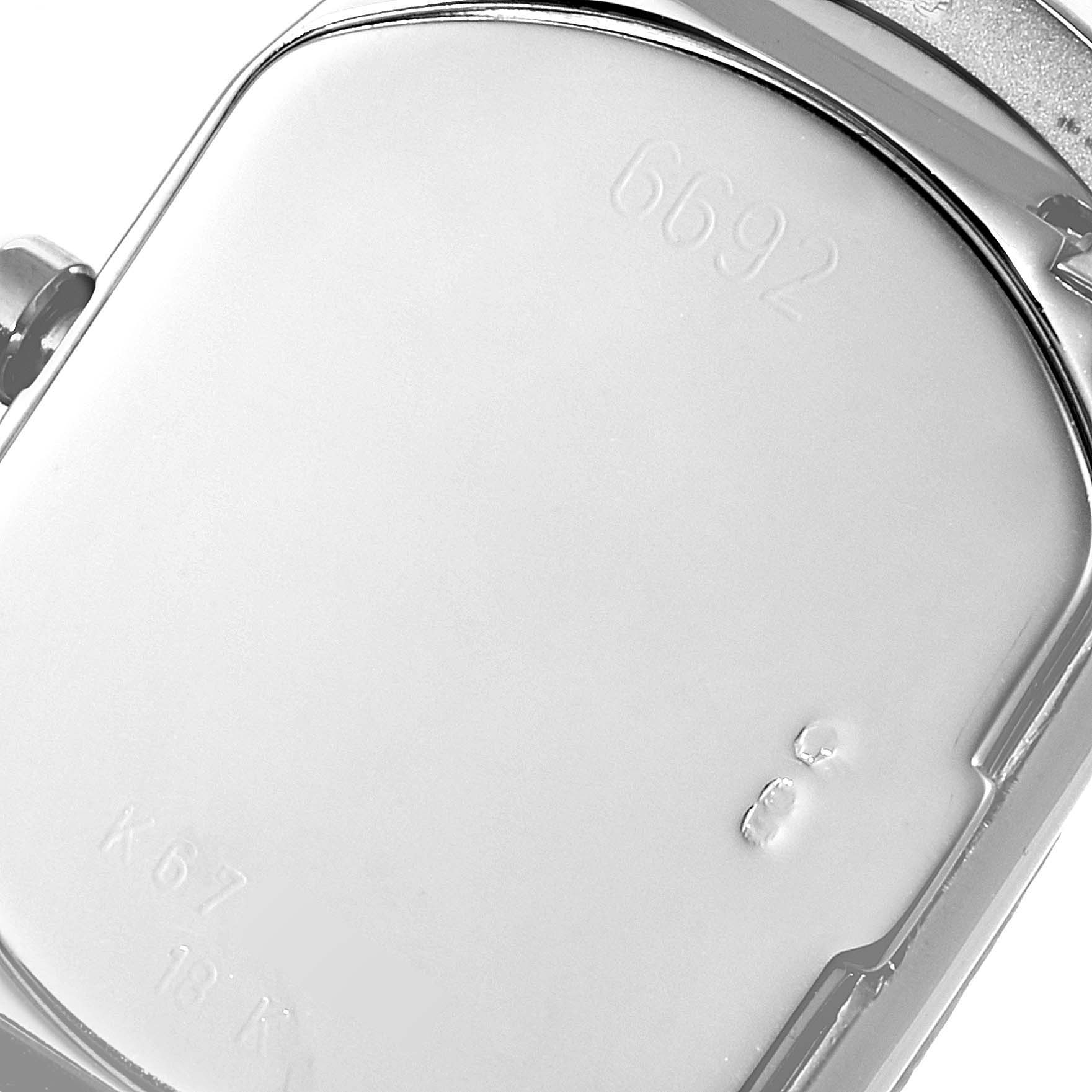 This image shows the back case of a Rolex Cellini 6692 Women's White Gold Mother of Pearl Dial 6692 Women's White Gold Mother of Pearl Dial model watch, with visible engravings.