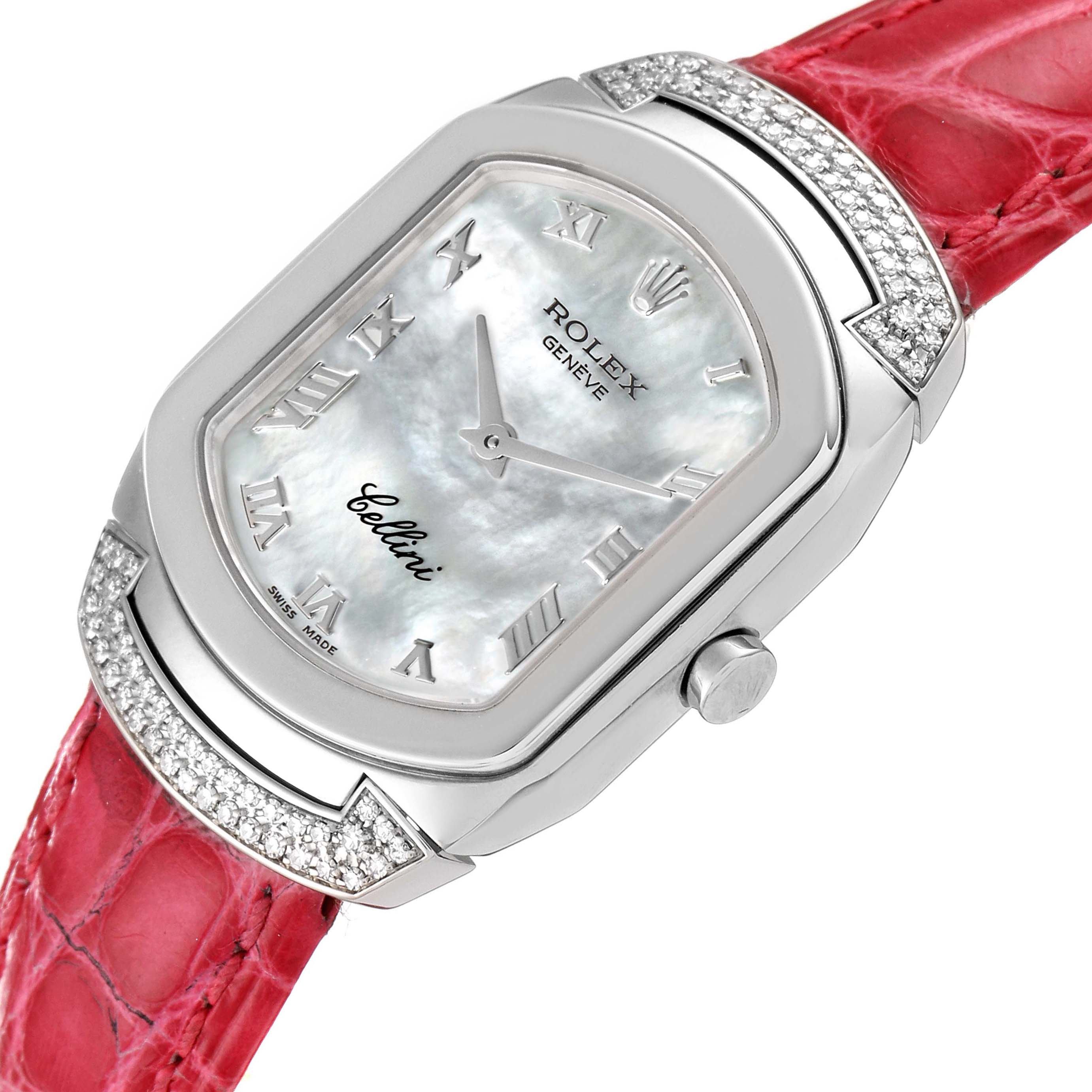 The image shows a close-up of the dial and bezel of the Rolex Cellini 6692 Women's White Gold Mother of Pearl Dial 6692 Women's White Gold Mother of Pearl Dial watch, prominently displaying its Roman numerals and red strap.
