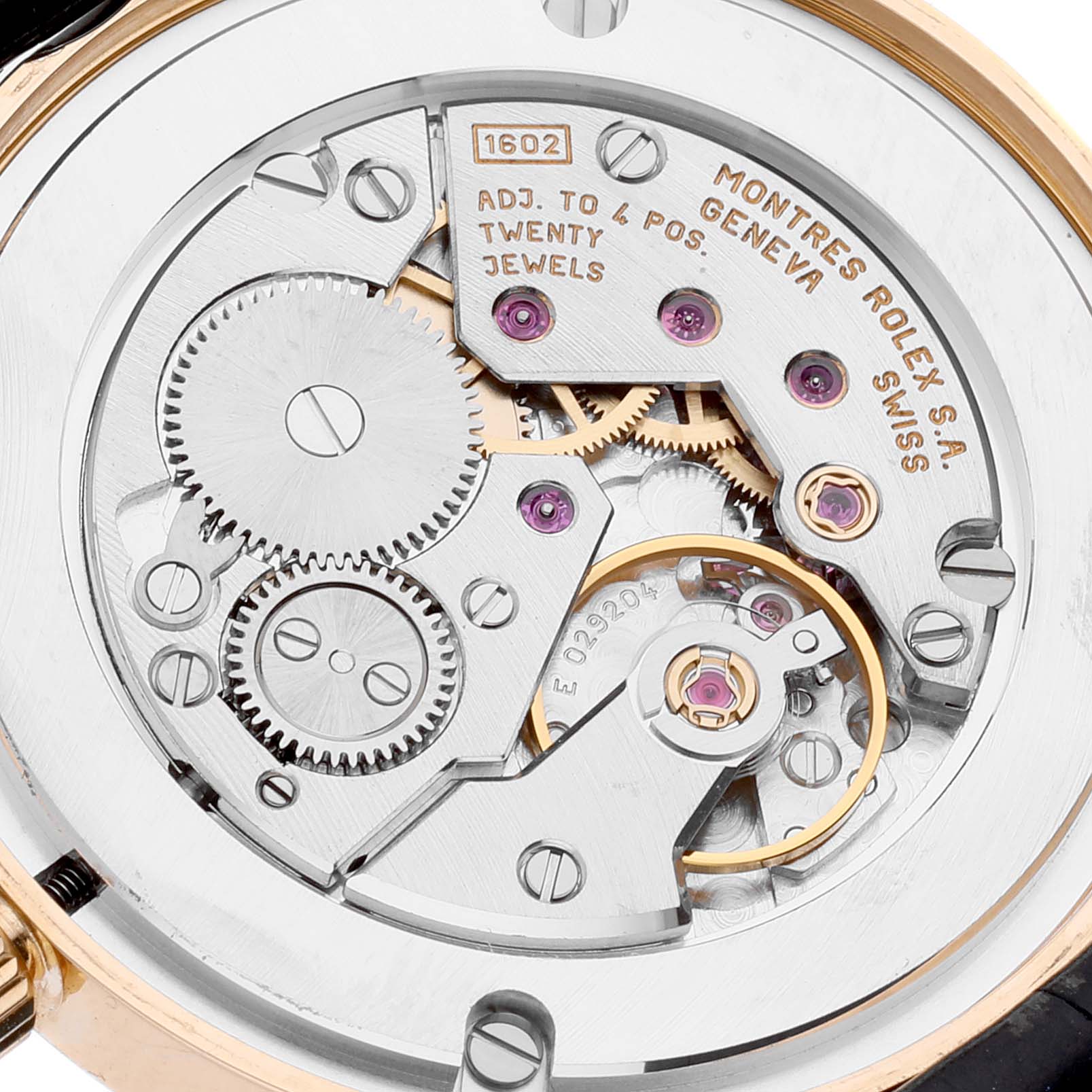 This image shows the back view of the movement mechanics of a Rolex Cellini 5116 Men's Yellow Gold Grey Dial 5116 Men's Yellow Gold Grey Dial watch, including gears and jewels.