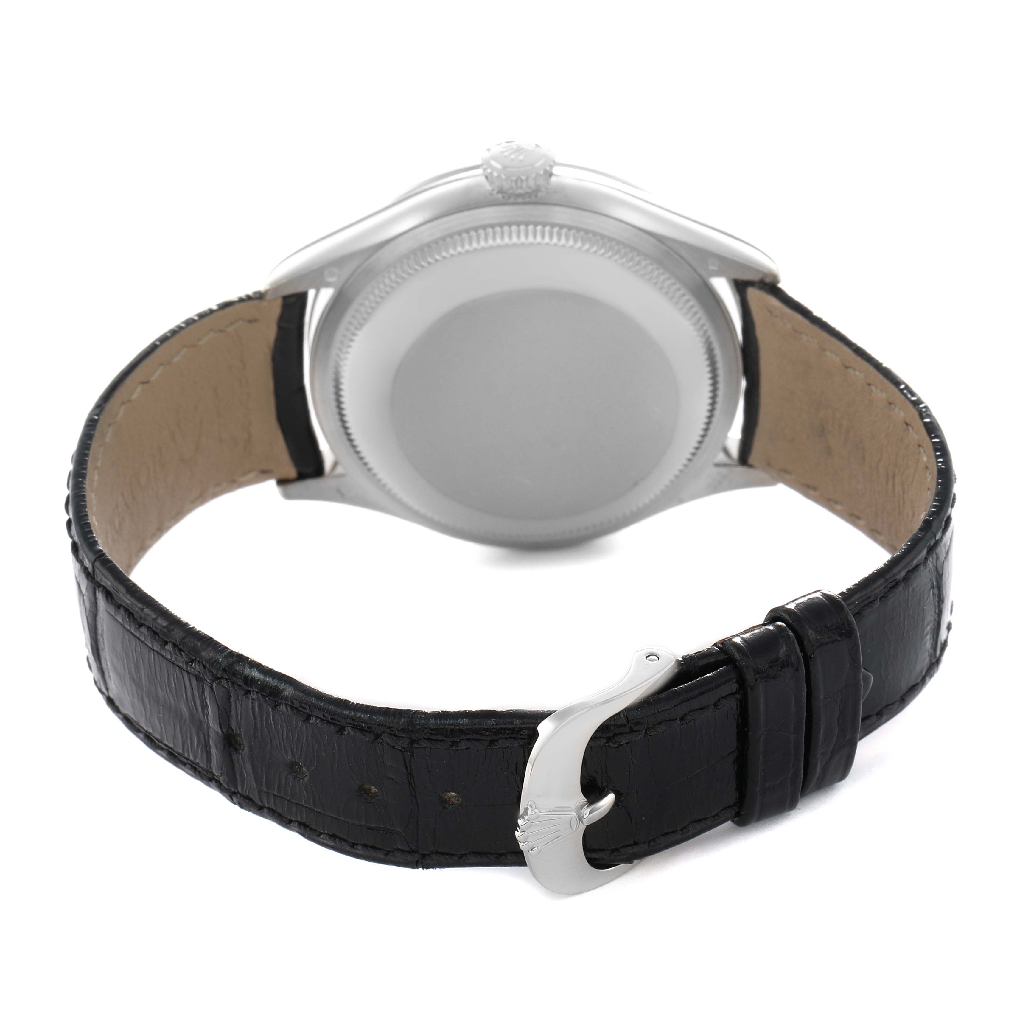 The image shows the back of a Rolex Cellini 50709 Men's White Gold Silver Dial watch with a visible leather strap and buckle.