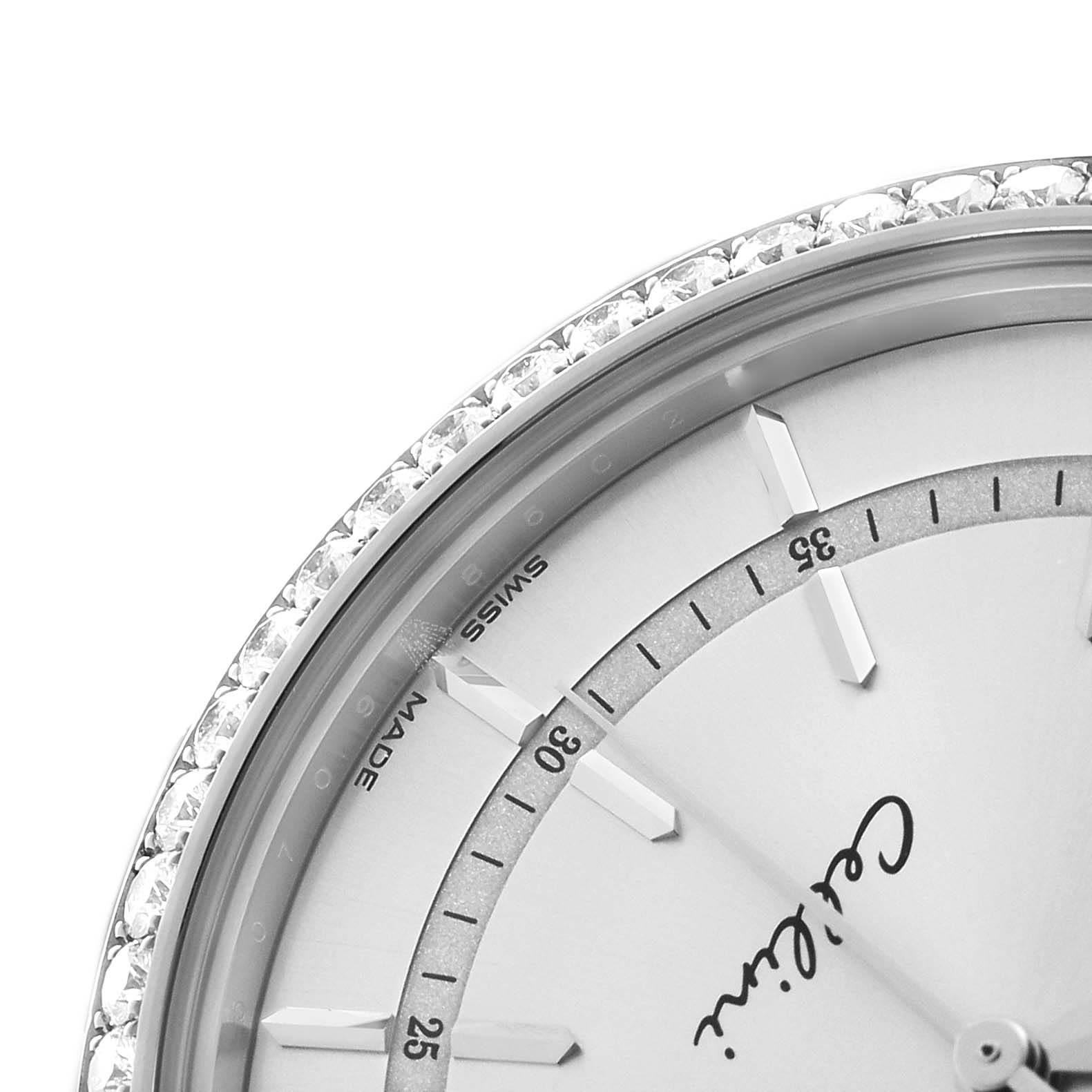 The image shows a close-up of the bezel and dial of the Rolex Cellini 50709 Men's White Gold Silver Dial watch, highlighting the indices and "Cellini" inscription.