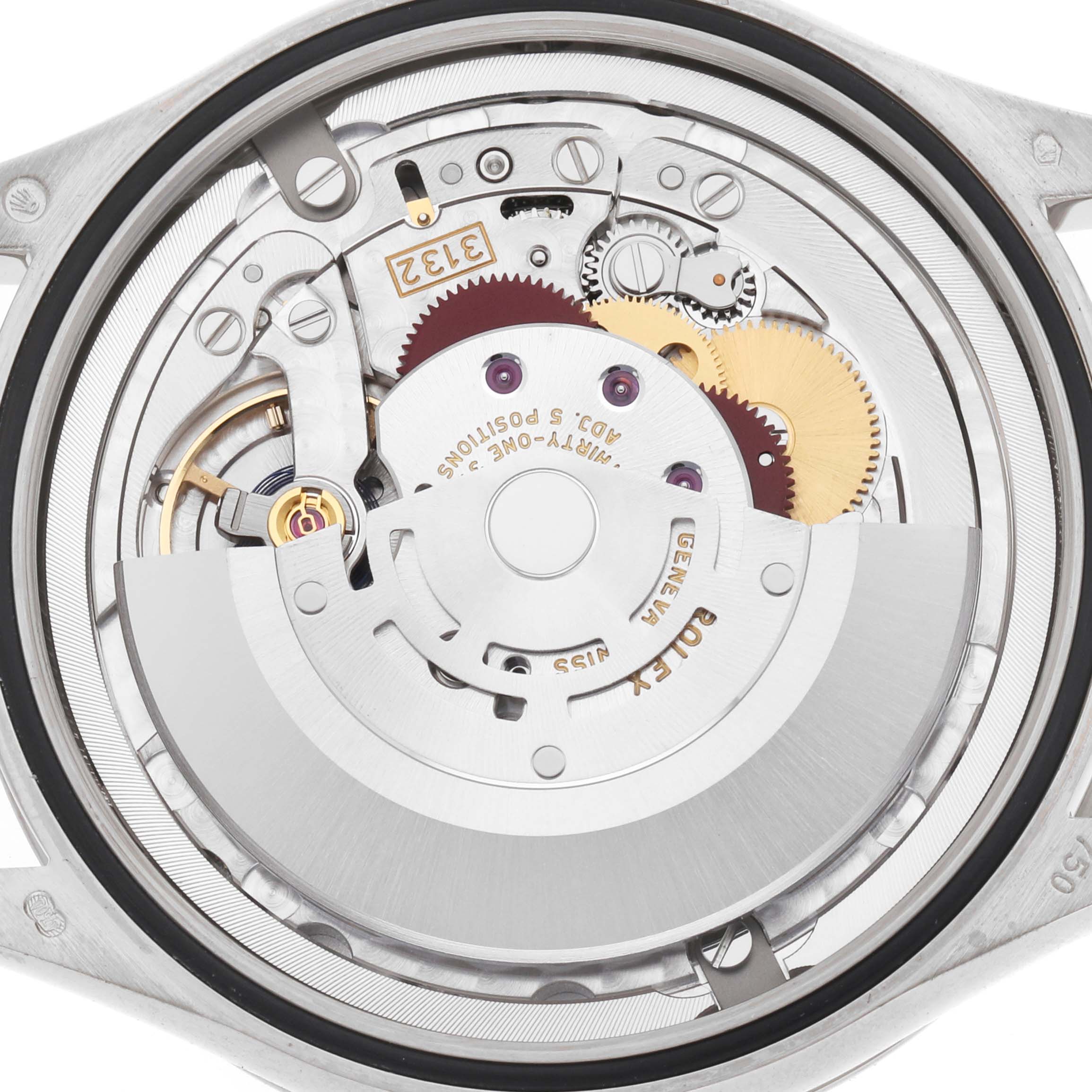 The image shows a close-up of the Rolex Cellini 50709 Men's White Gold Silver Dial watch movement from the back, highlighting gears and mechanical components.