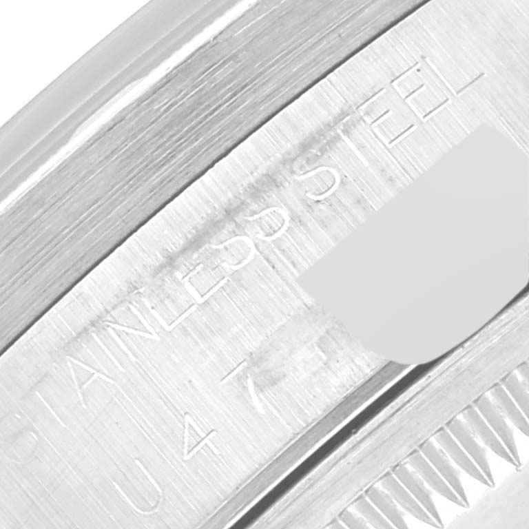This image shows a close-up of the stainless steel case back and part of the inscription on a Rolex Date 15210 Men's Stainless Steel Blue Dial 15210 Men's Stainless Steel Blue Dial model watch.