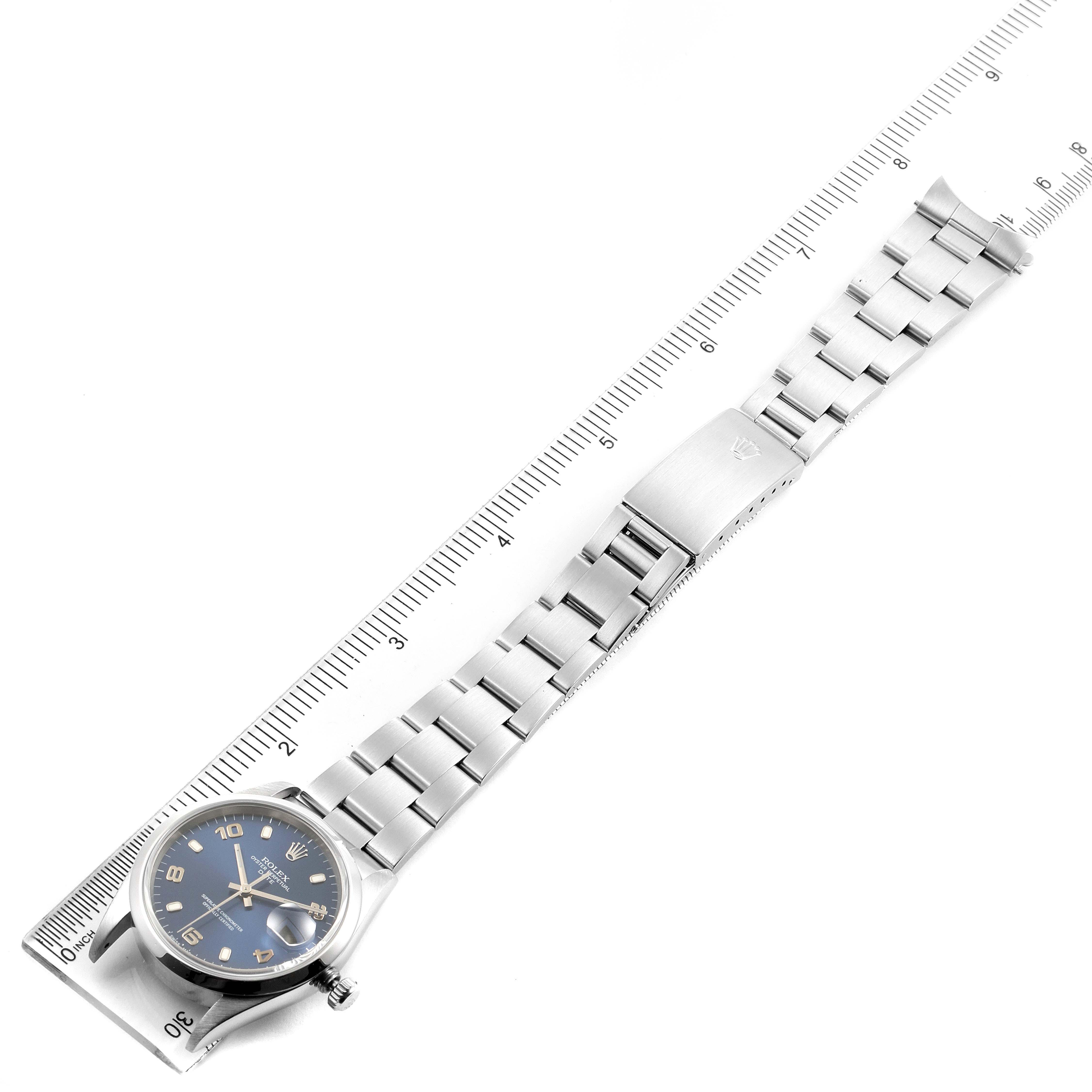 This image shows a Rolex Date 15200 Men's Stainless Steel Blue Dial 15200 Men's Stainless Steel Blue Dial model watch laid flat, with a ruler for size reference, displaying its face and bracelet.