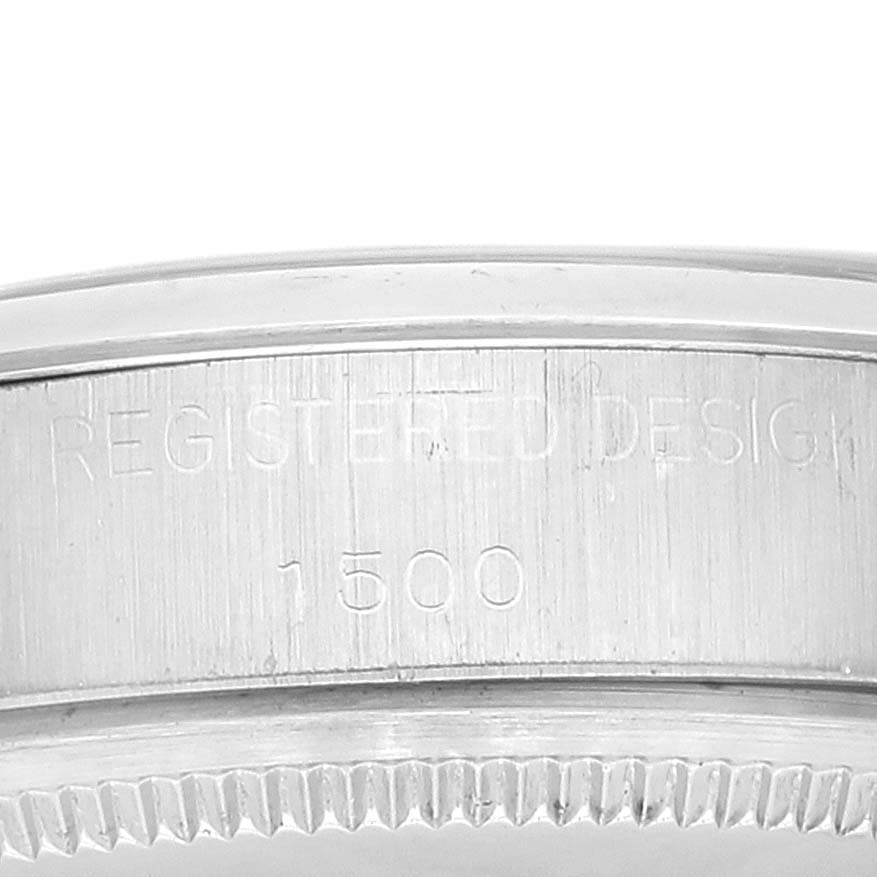 This image shows the engraved case back of a Rolex Date 1500 Men
s Stainless Steel Silver Dial 1500 Men
s Stainless Steel Silver Dial model watch with "REGISTERED DESIGN" and the number "1500" visible.