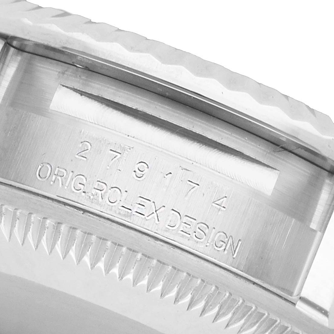 The image focuses on the side of a Rolex Datejust 279174 Women's Stainless Steel Silver Dial, showing the serial number and "Orig. Rolex Design" engraving.