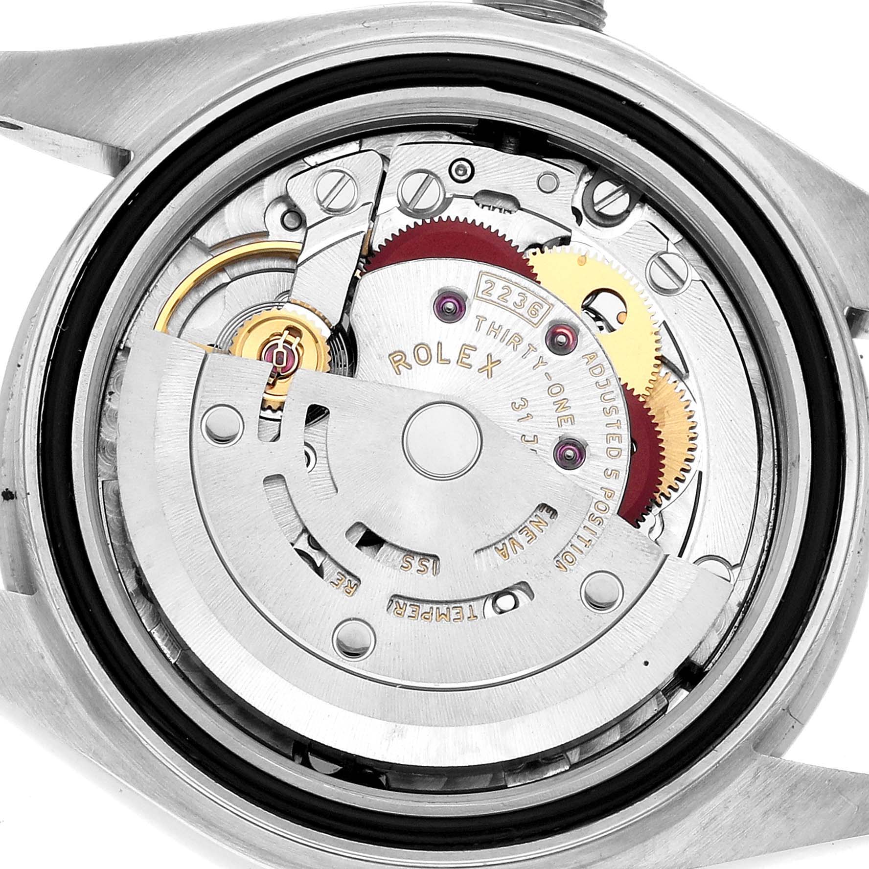 The image shows the internal mechanism of a Rolex Datejust 279174 Women's Stainless Steel Silver Dial watch from a top-down angle with visible gears and rotor.