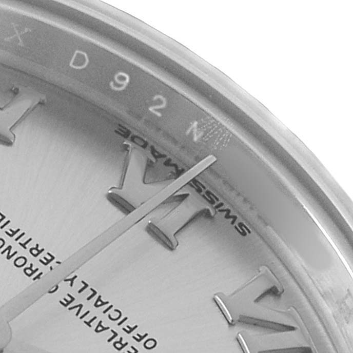 The image shows a close-up of a Rolex Datejust 279174 Women's Stainless Steel Silver Dial watch dial and chapter ring, featuring Roman numerals and the word "SWISS MADE."