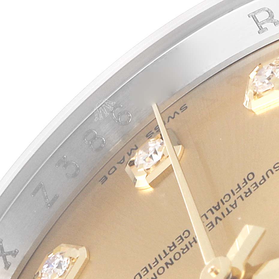 This close-up image shows the dial, markers, and partial bezel of a Rolex Datejust 116233 Men's Steel and Gold (two tone) Champagne Dial 116233 Men's Steel and Gold (two tone) Champagne Dial.