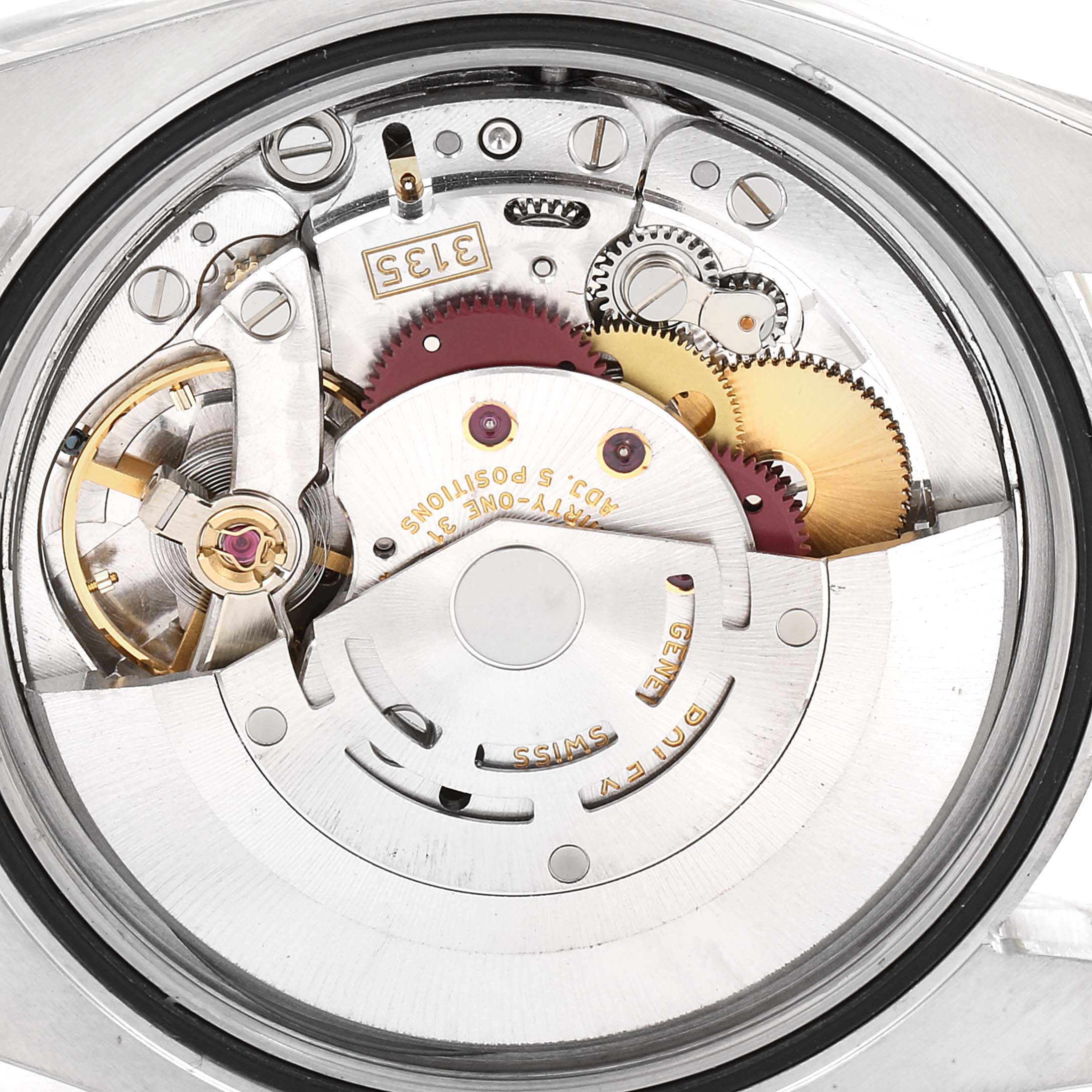The image shows the internal mechanical movement of a Rolex Datejust 116233 Men's Steel and Gold (two tone) Champagne Dial 116233 Men's Steel and Gold (two tone) Champagne Dial watch, with gears and other components visible from a back angle.