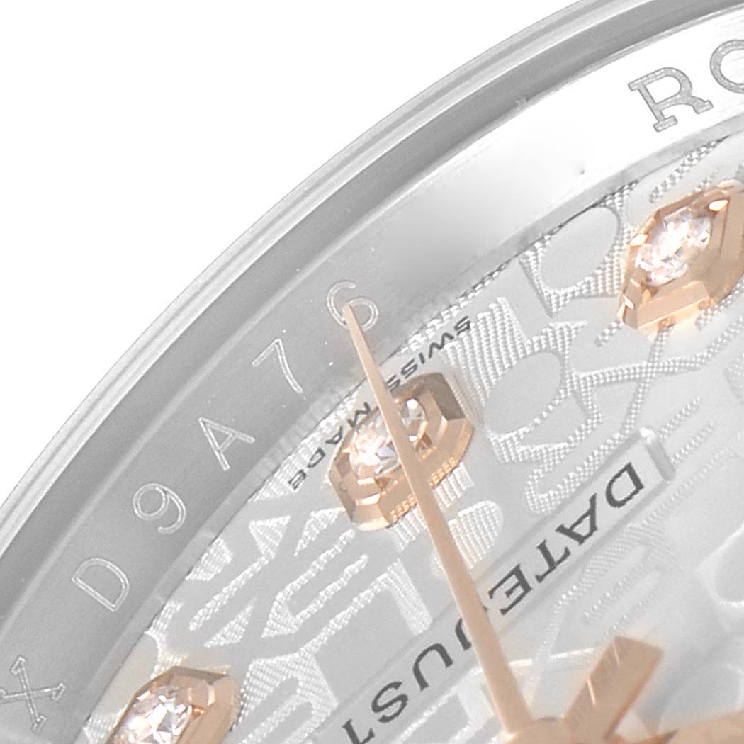 This close-up angle of the Rolex Datejust 116231 Men's Steel and Gold (two tone) Silver Dial 116231 Men's Steel and Gold (two tone) Silver Dial watch reveals the edge of the dial, indices, and partial text.