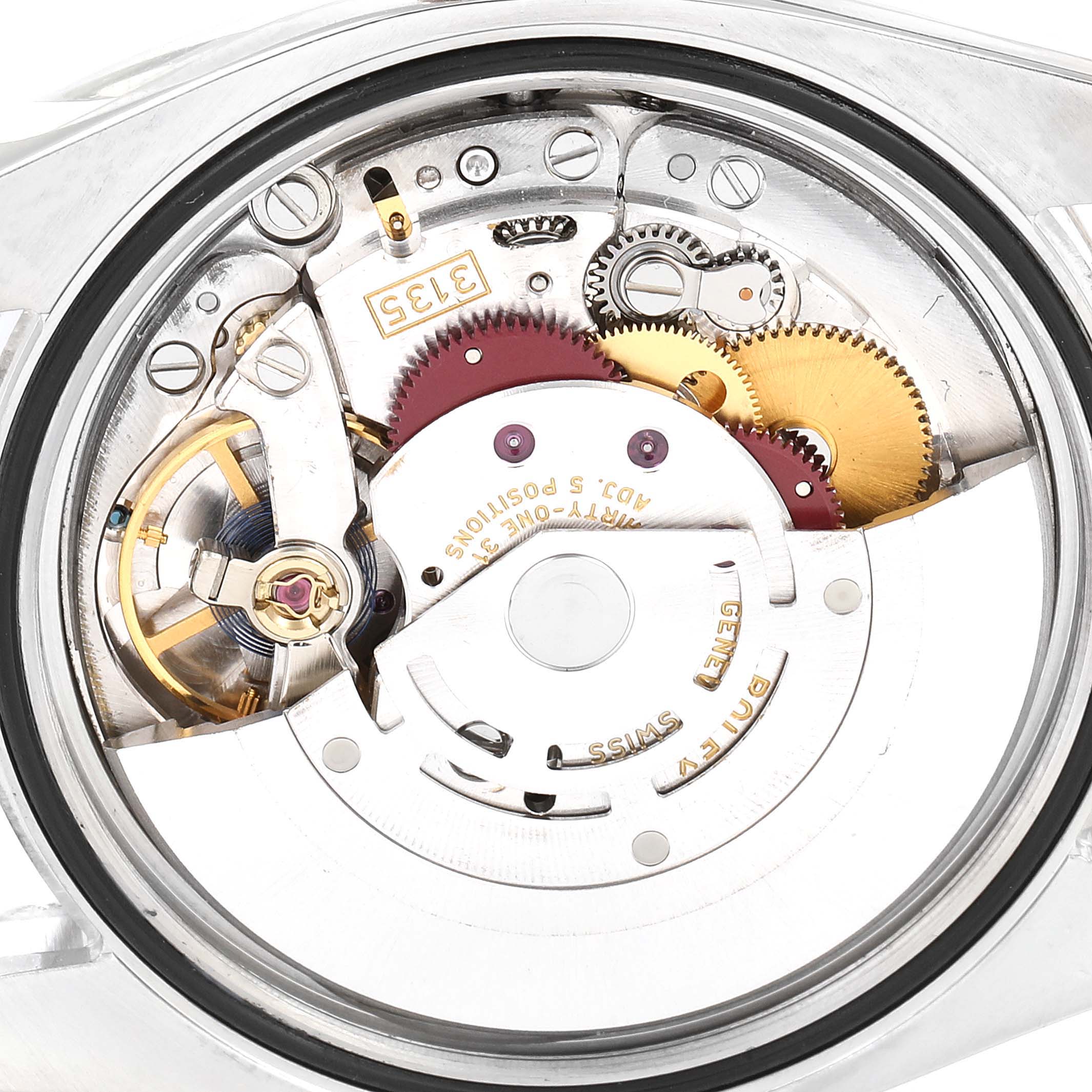The image shows an internal view of the movement mechanism of a Rolex Datejust 116231 Men's Steel and Gold (two tone) Silver Dial 116231 Men's Steel and Gold (two tone) Silver Dial watch.