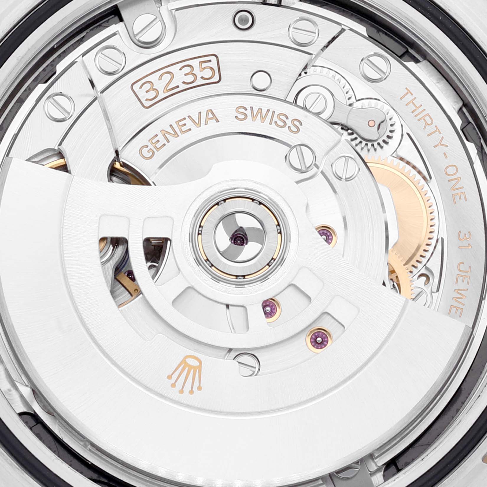 This image shows a close-up view of the movement and inner mechanism of a Rolex Datejust 41 126303 Men's Steel and Gold (two tone) Black Dial 126303 Men's Steel and Gold (two tone) Black Dial watch.