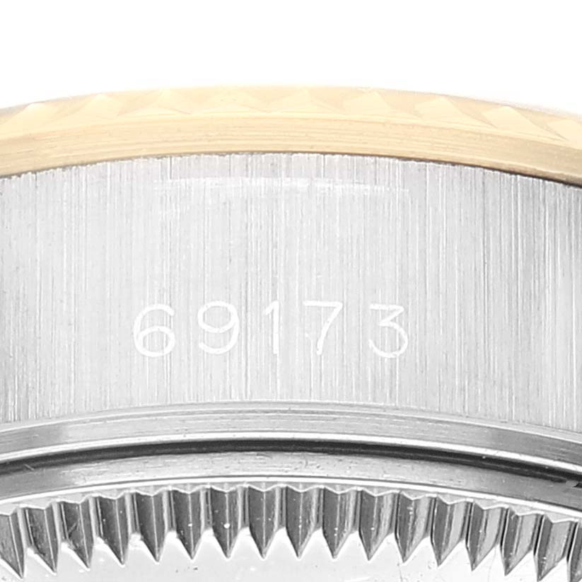 The image shows a close-up of the model number 69173 engraved on the side of a Rolex Datejust 69173 Women's Steel and Gold (two tone) Blue Dial 69173 Women's Steel and Gold (two tone) Blue Dial bezel.