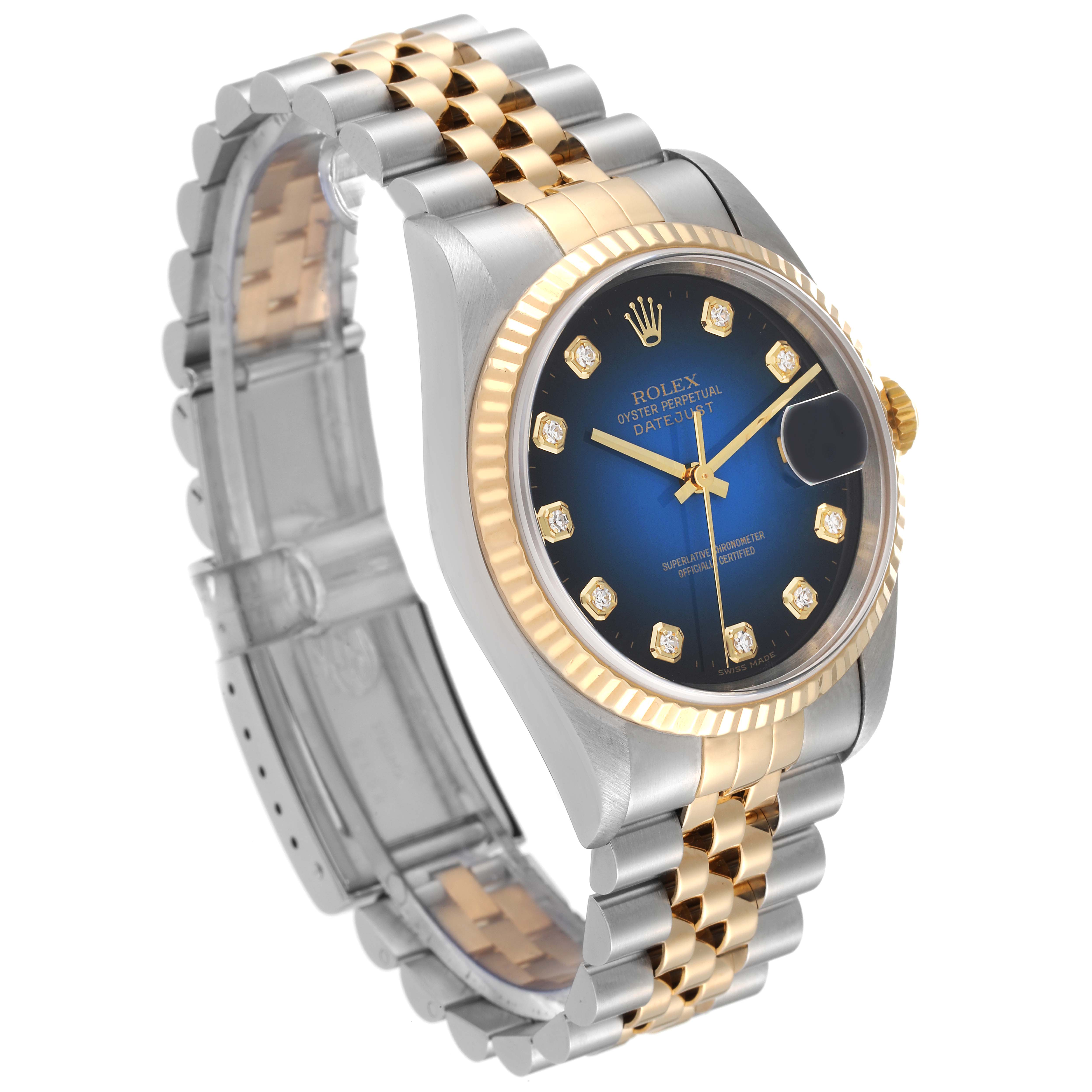 The Rolex Datejust 16233 Men's Steel and Gold (two tone) Blue Dial 16233 Men's Steel and Gold (two tone) Blue Dial watch is shown at a slight angle, highlighting its face, gold bezel, and two-tone bracelet.