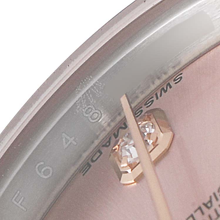 The image shows a close-up of the Rolex Datejust 179171 Women's Steel and Gold (two tone) Pink Dial 179171 Women's Steel and Gold (two tone) Pink Dial watch face, highlighting the dial, the "Swiss Made" inscription, and a diamond hour marker.