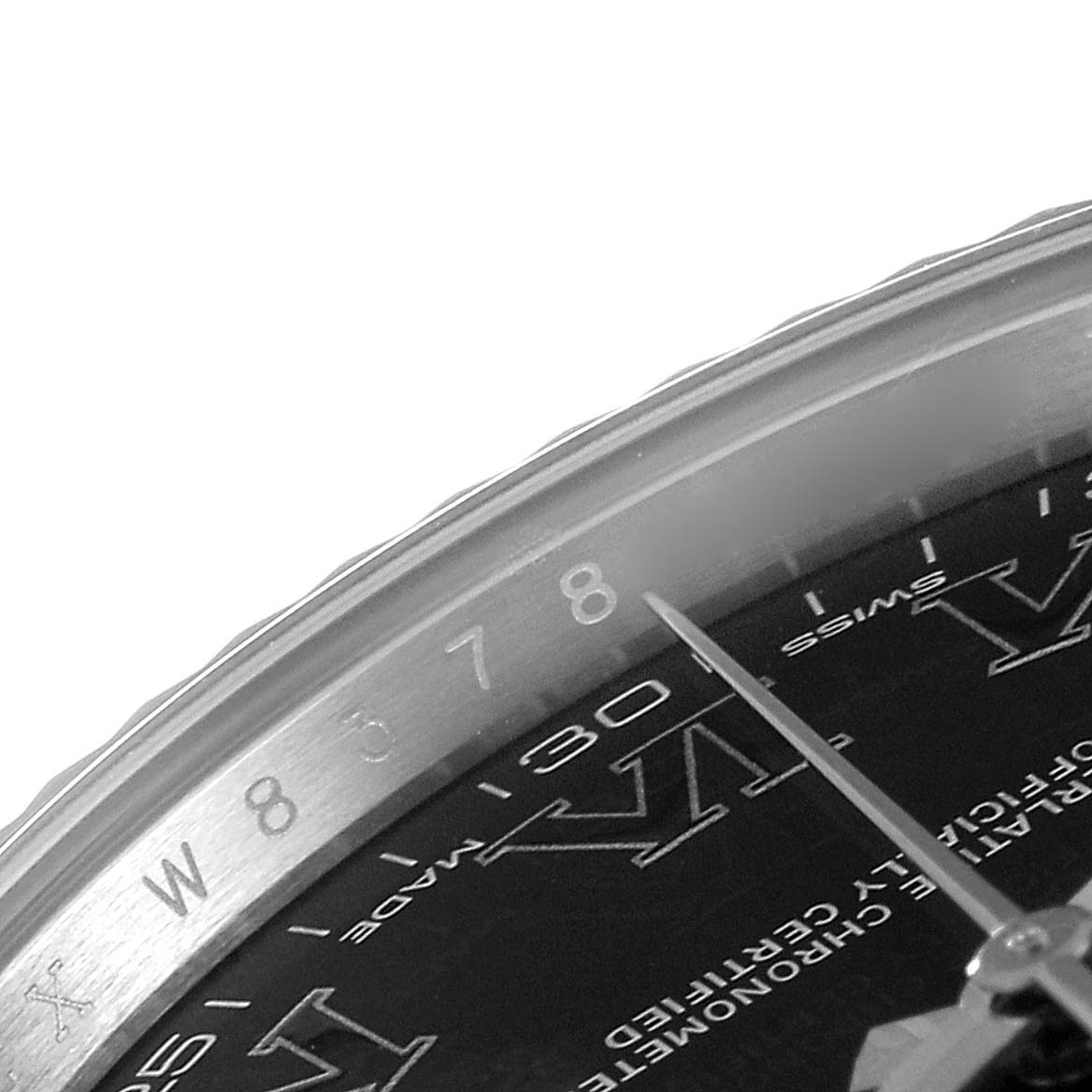 The image shows a close-up of the dial and part of the bezel of a Rolex Datejust 41 116334 Men
s Stainless Steel Grey Dial 116334 Men
s Stainless Steel Grey Dial watch, specifically near the 8 o
clock position.